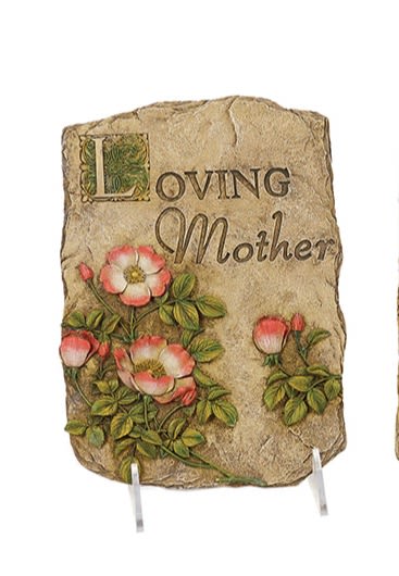 Decorative stone plaque with 'Loving Mother' text and pink floral carvings on a stand
