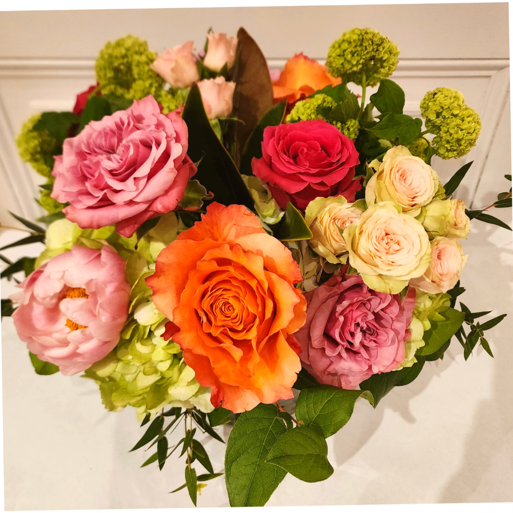 Mixed bouquet of roses, peonies, and green hydrangeas