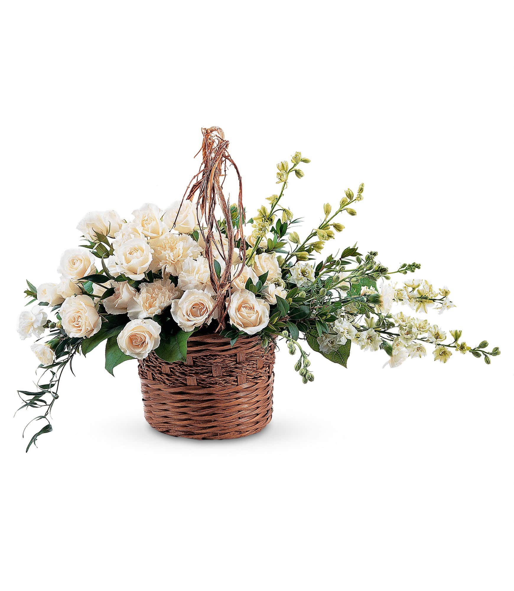 White roses and cream carnations in a wicker basket with trailing greenery