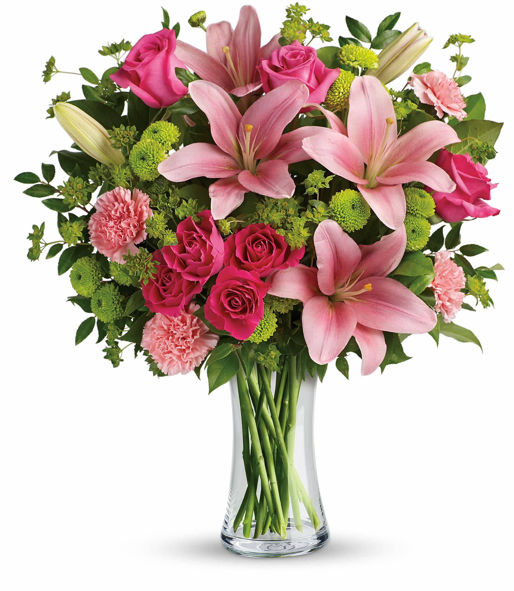 Pink lilies, roses, and carnations in a clear glass vase