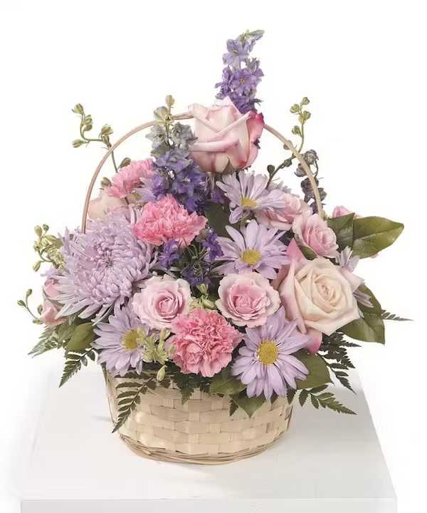 Pastel flower basket with roses, daisies, and carnations