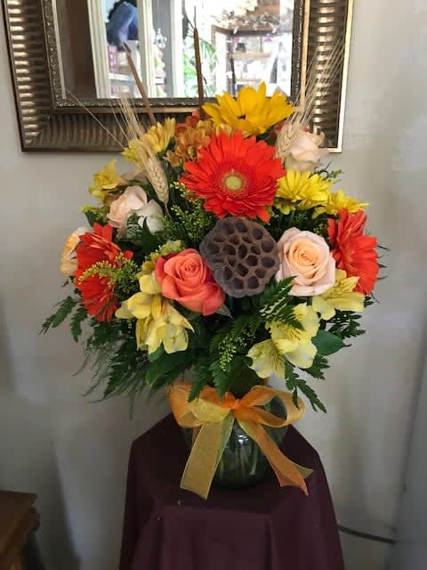 AUTUMN VASE ARRANGEMENT - A bold mix of fall flowers in a glass vase. Colorful and Vibrant!