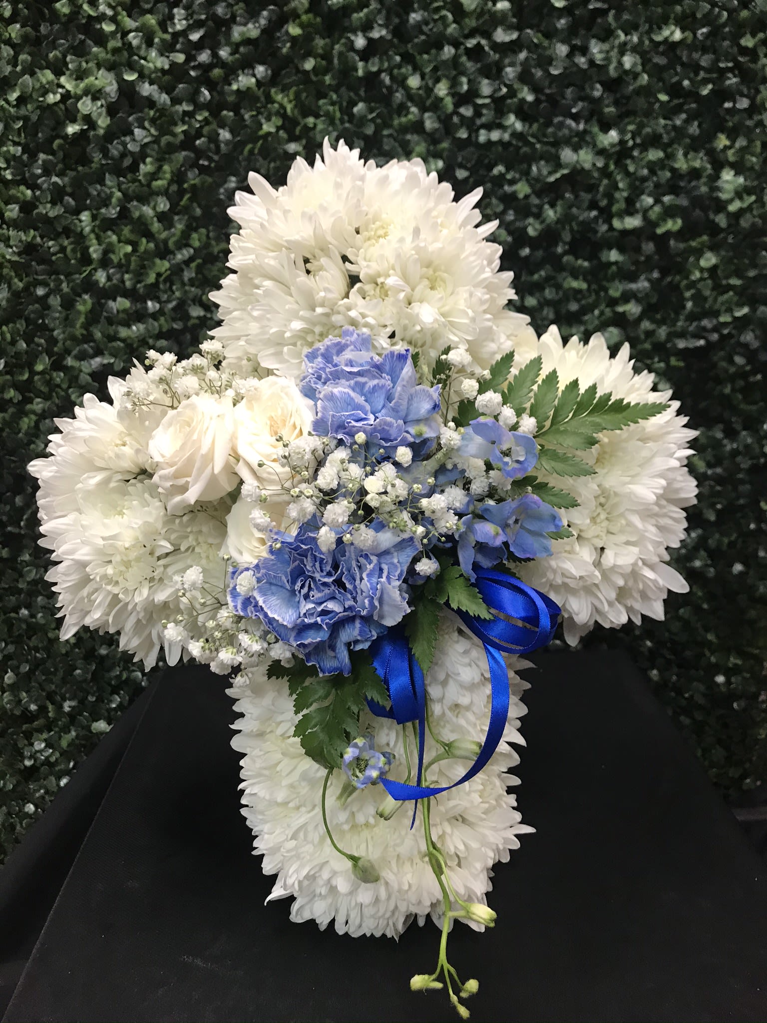White chrysanthemum bouquet with blue carnations and ribbon