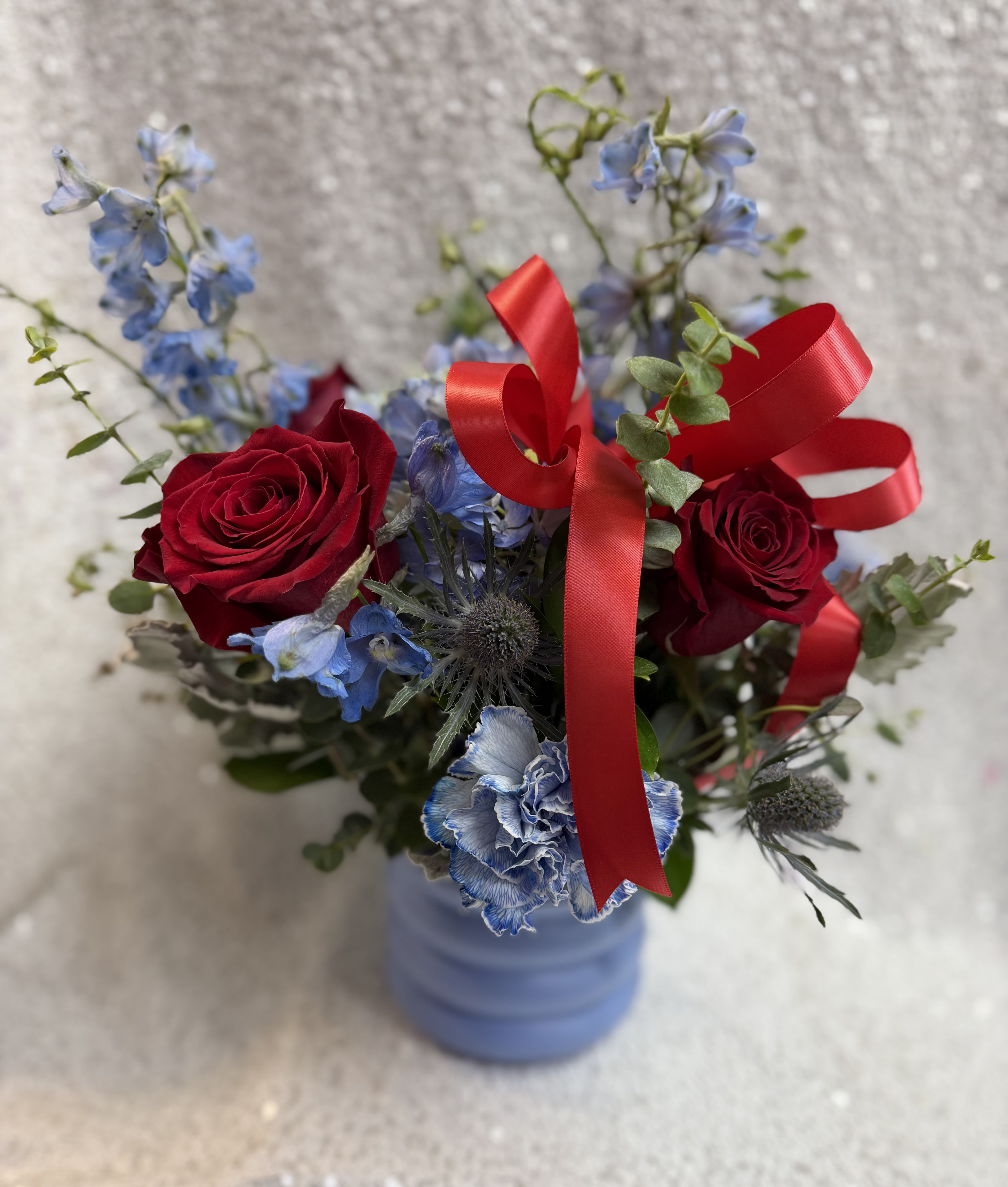 SMILE ALWAYS - RED ROSES,IIN A DELICATE BLUE VASE