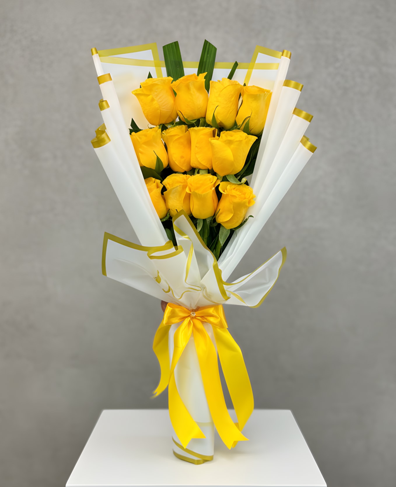 Golden Yellow Rose Bouquet - Bright, cheerful, and full of warmth, the Yellow Rose Bouquet features fresh yellow roses beautifully arranged and wrapped in stylish premium paper. Yellow roses symbolize friendship, joy, and new beginnings, making this bouquet perfect for birthdays, celebrations, thank-you gifts, or simply brightening someone’s day. Carefully hand-wrapped for a modern and elegant presentation, it’s a beautiful way to share happiness and positivity. STANDARD 12 ROSES DELUXE 24 ROSES PREMIUM 36 ROSES