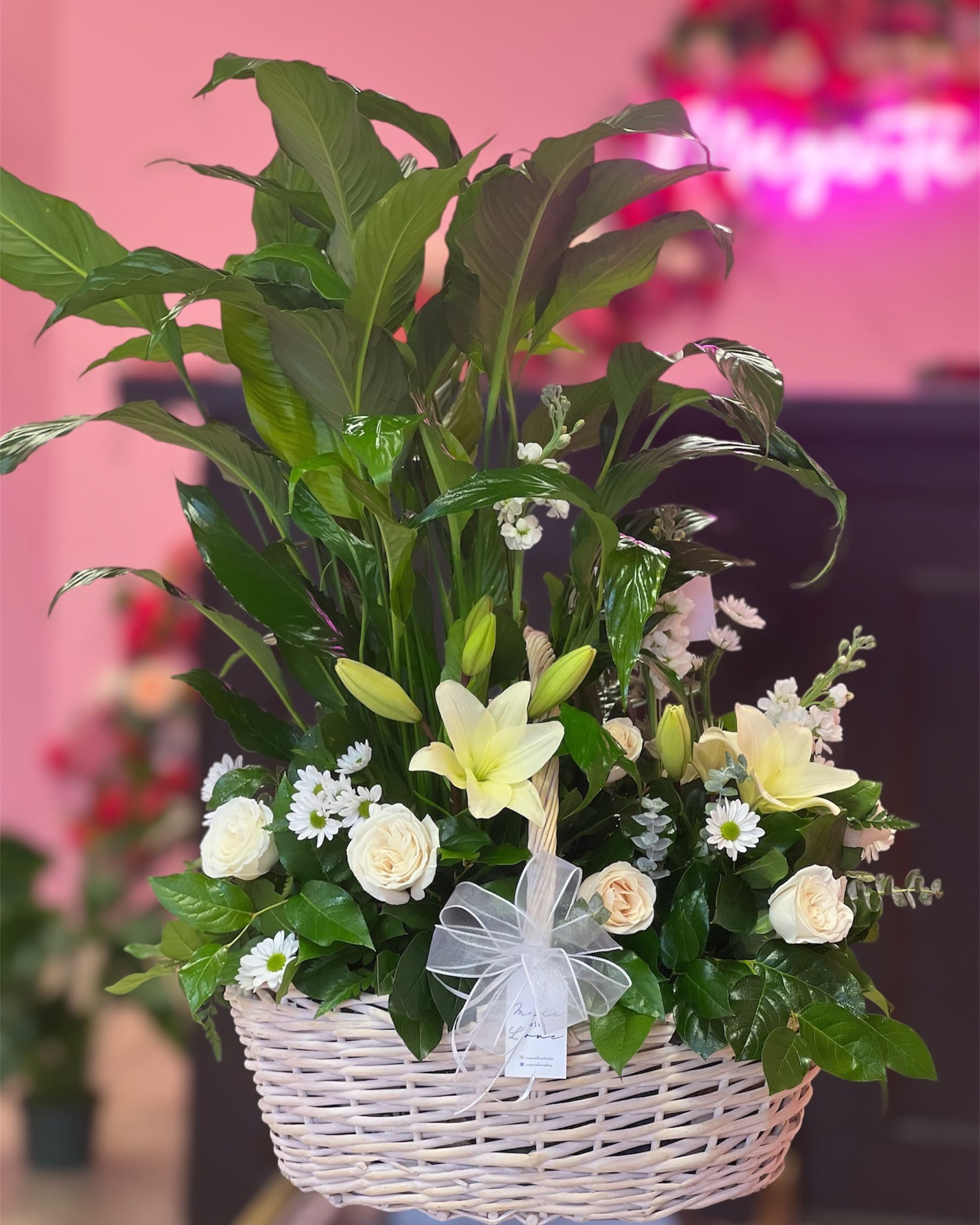 Sympathy Basket - This large basket is made with a pretty peace Lilly and fresh blooms. Perfect to show your love and sympathy in those hard times. 