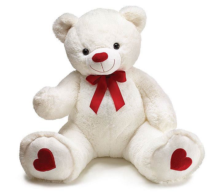 White teddy bear with a red bow and heart-shaped paw pads