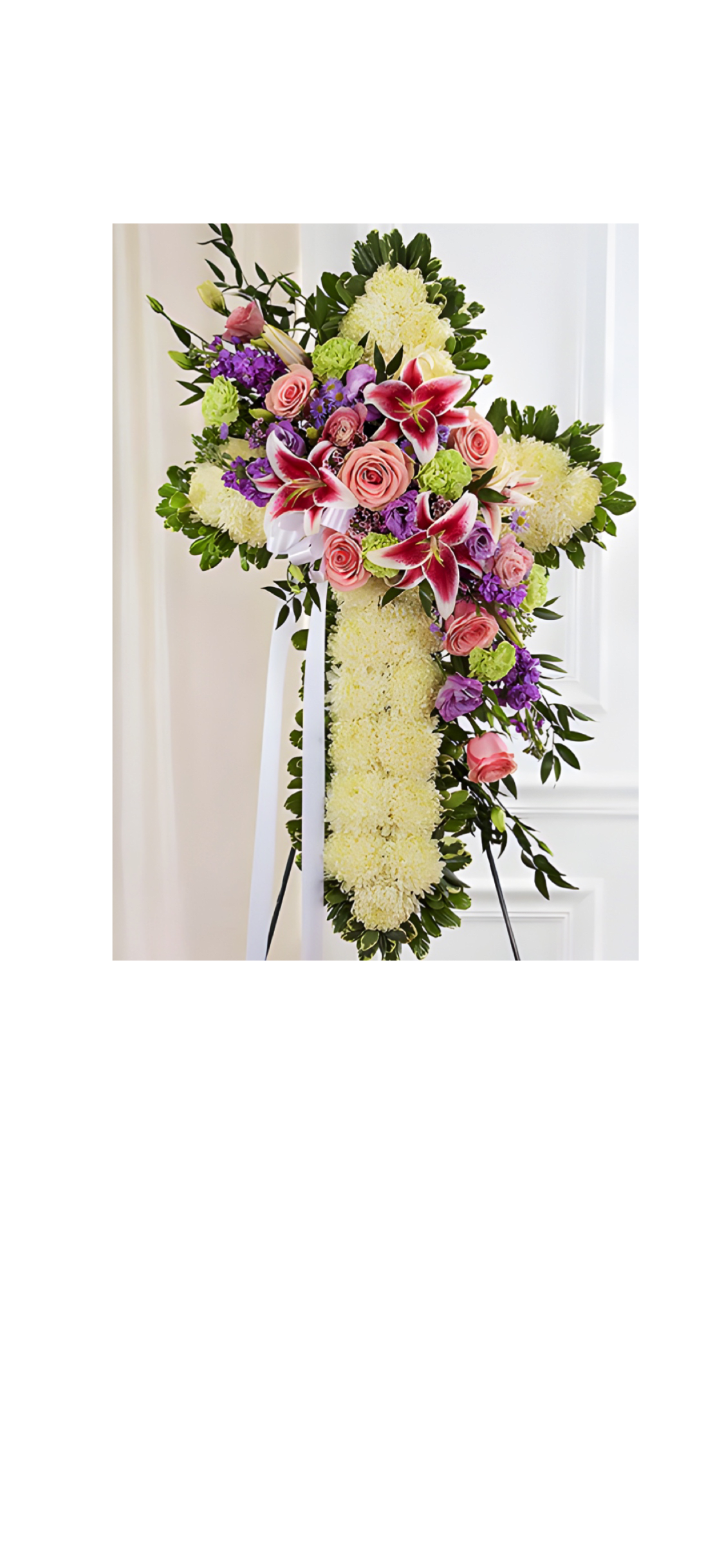 Cross  wreath  - Beautiful Mix of fresh flowers suntly placed over a bed of light flowers in shape of a cross. A lovely reflection of faith for your loved one Z