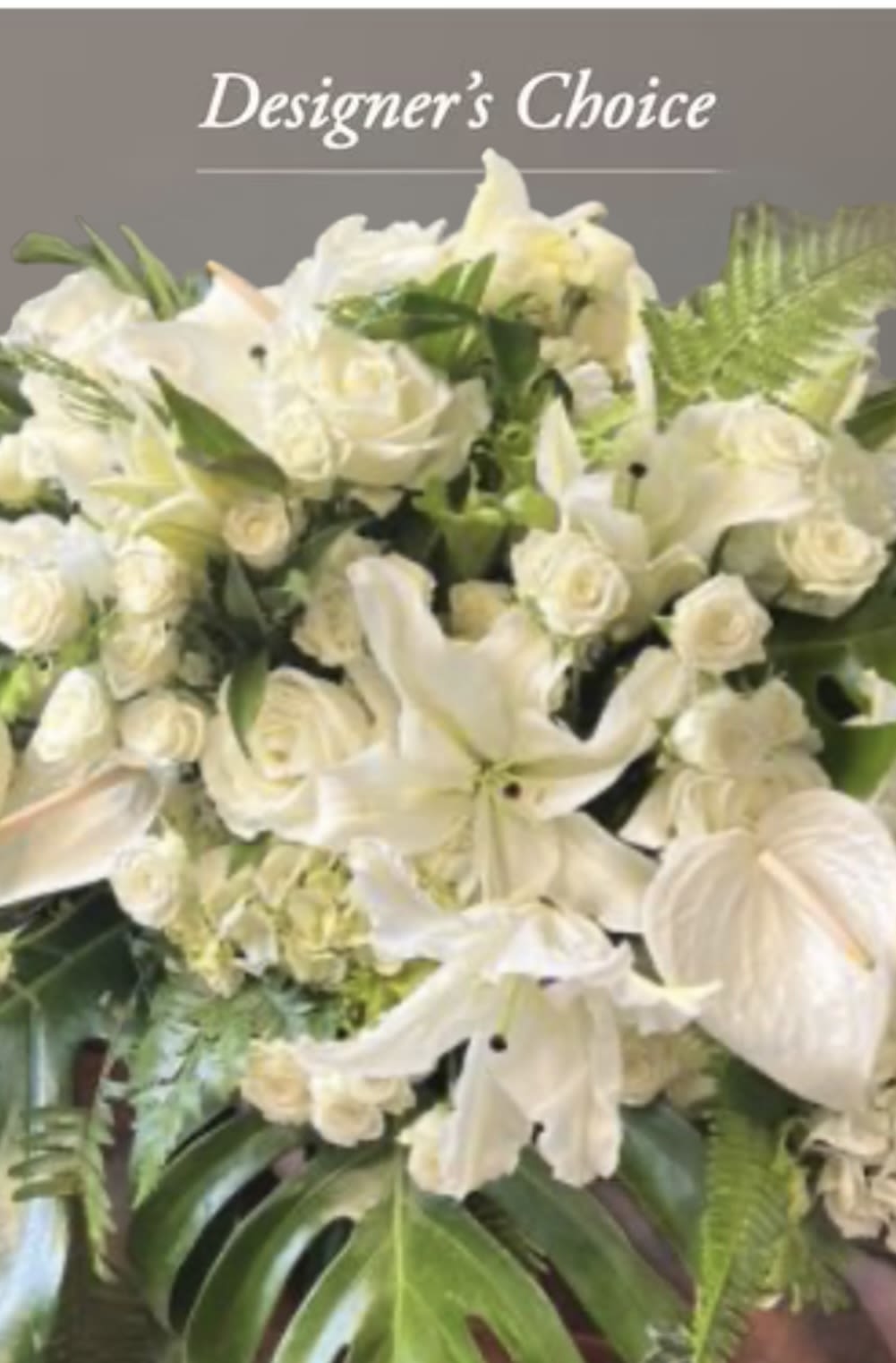 White floral arrangement with roses and lilies