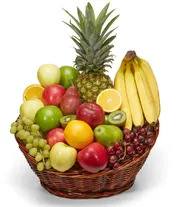Basket of assorted fruit with a pineapple and bananas