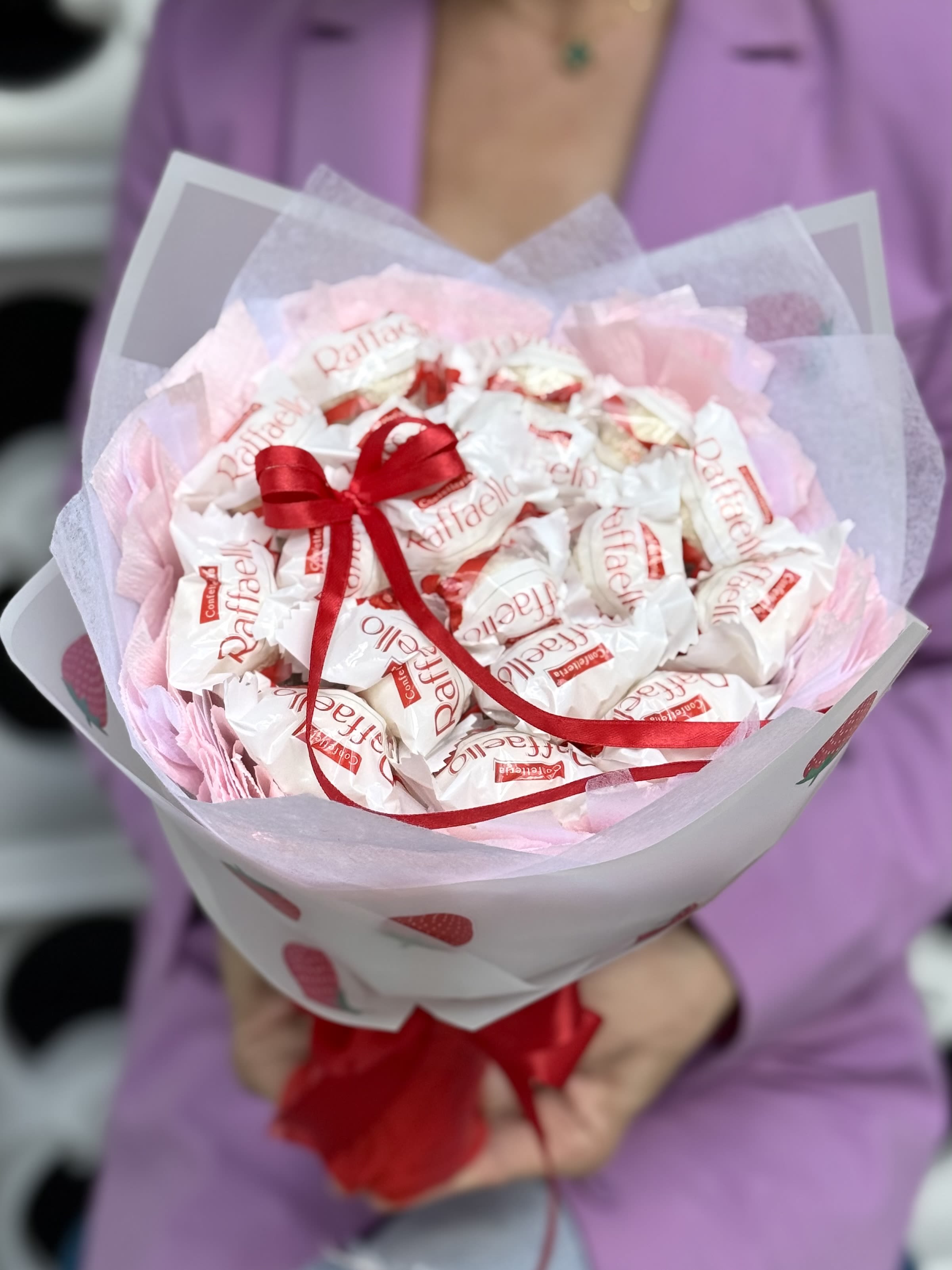 Sweet Strawberry Raffaello Bouquet - Featuring the beloved coconut and almond Raffaello treats, this edible bouquet makes a unique alternative to traditional flowers. Whether you're celebrating a birthday, Valentine's Day, Mother's Day, an anniversary, or simply sending a thoughtful gift, this candy bouquet is designed to create smiles and lasting memories.