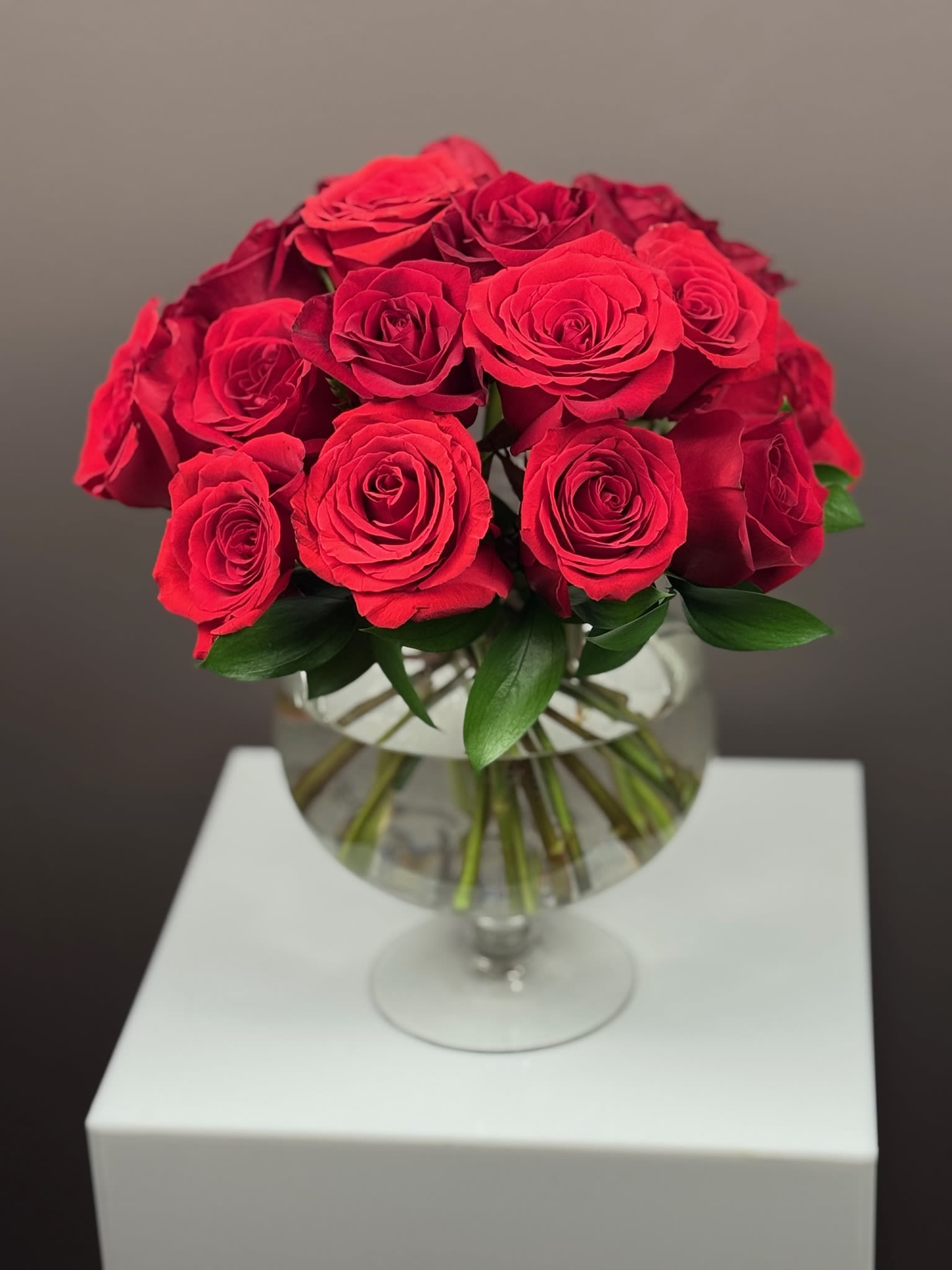 Bouquet of red roses in a clear glass vase