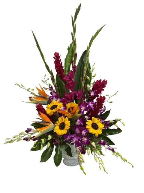 Tall tropical bouquet with sunflowers, purple orchids, and bird of paradise in a vase