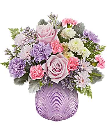 Pink and lavender bouquet in a purple vase