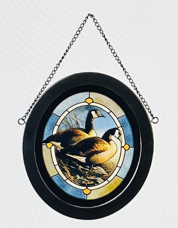 Round hanging plaque with a painted goose scene
