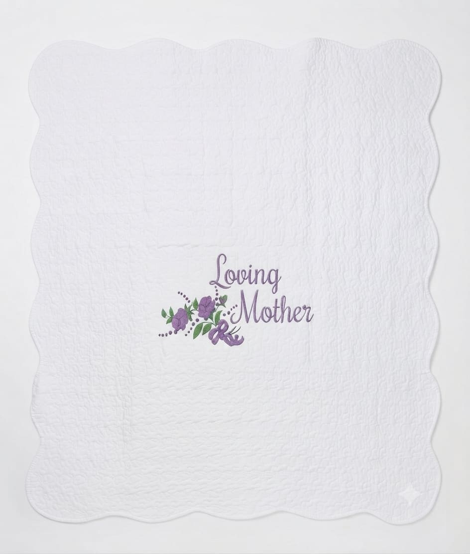 White quilted blanket with a purple "Loving Mother" floral design