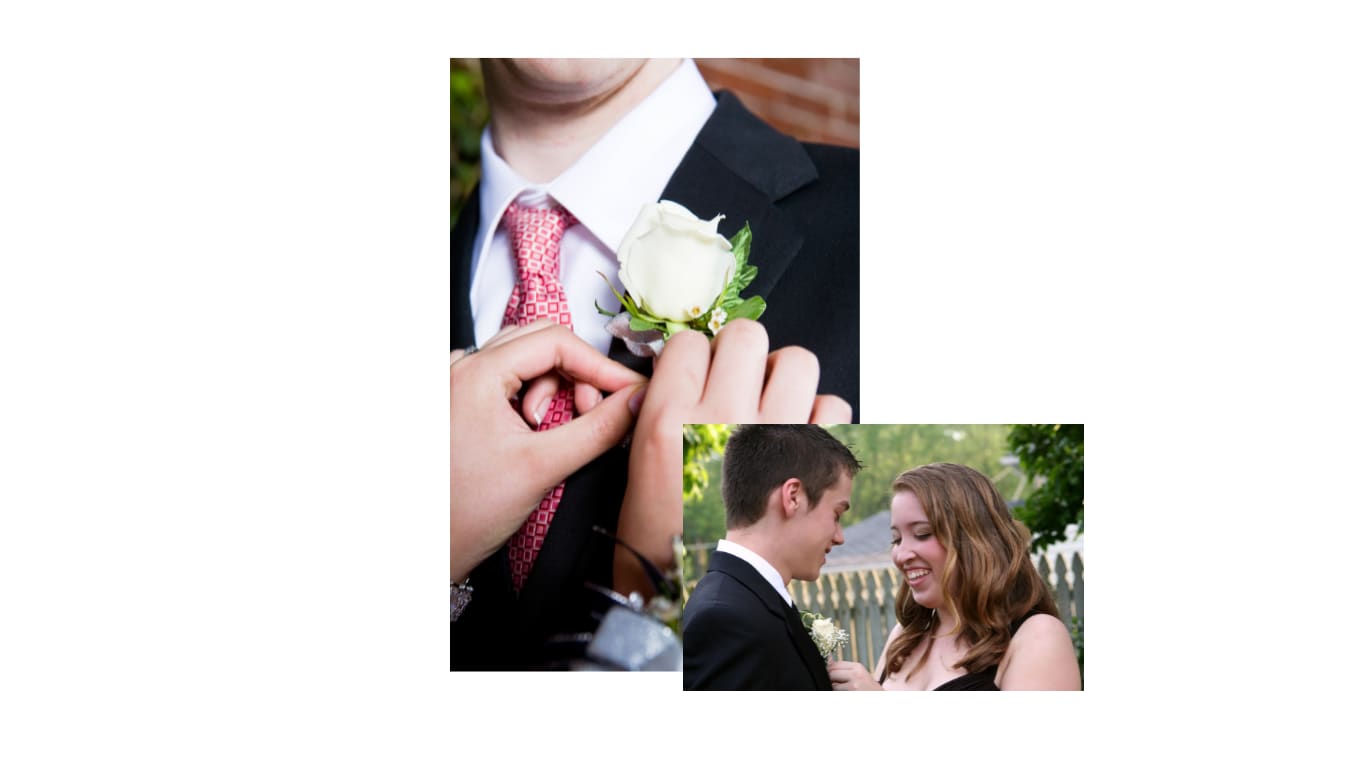 White rose boutonniere being pinned to a suit jacket