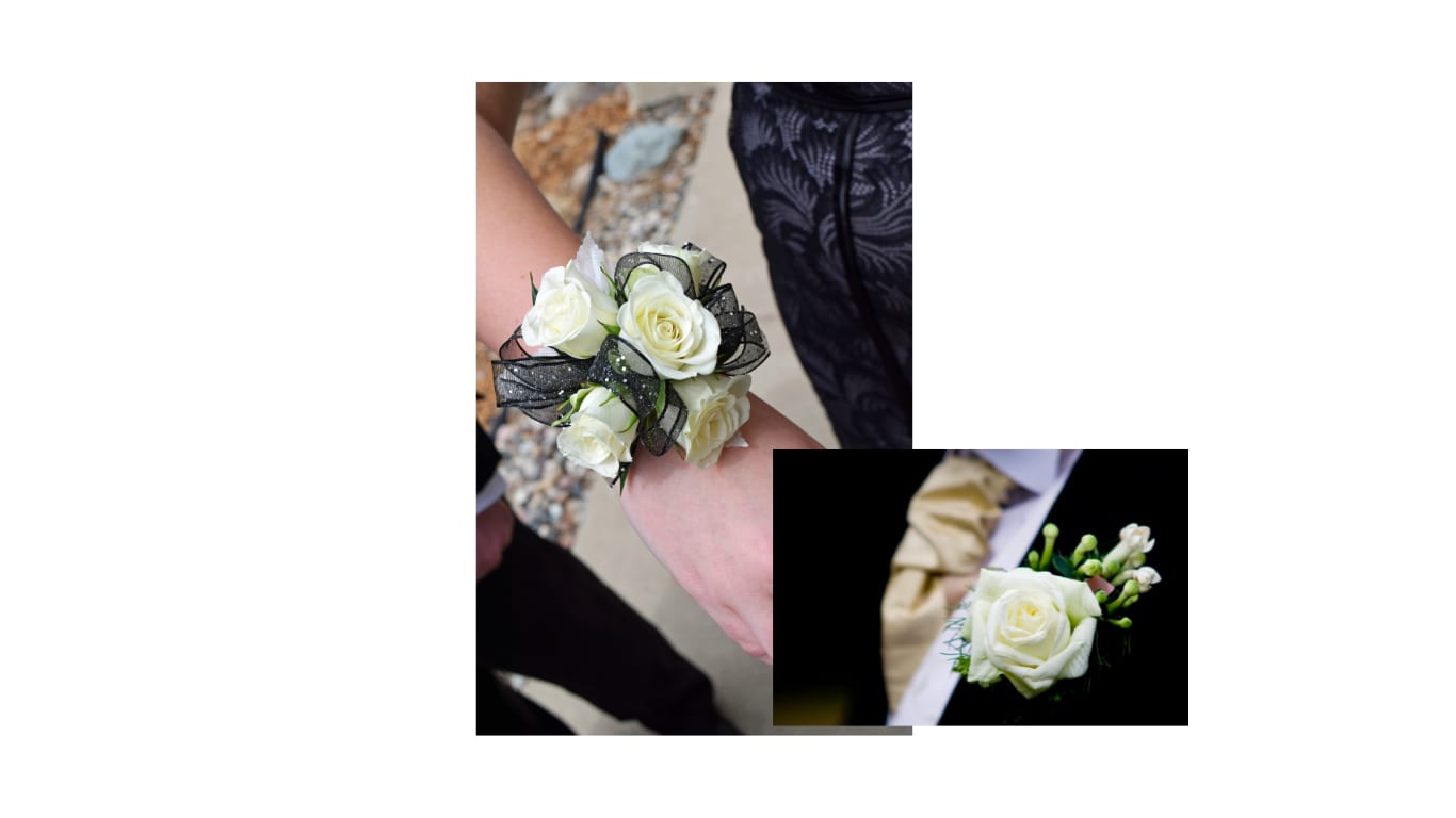 White rose wrist corsage with black ribbon and a white rose boutonniere