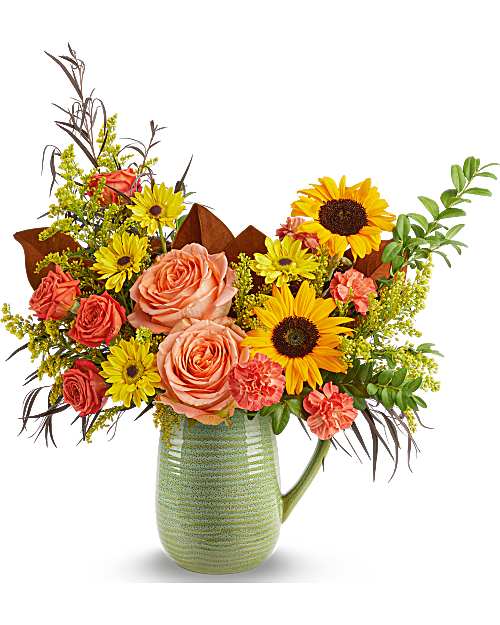 Teleflora's Sensational Harvest Bouquet - Celebrate the richness of the season with Teleflora's Sensational Harvest Bouquet, where golden sunflowers and warm autumn blooms come alive in Teleflora's Modern Sage Pitcher. With its soft, textured, food-safe design, it's a vibrant fall bouquet that doubles as a keepsake.