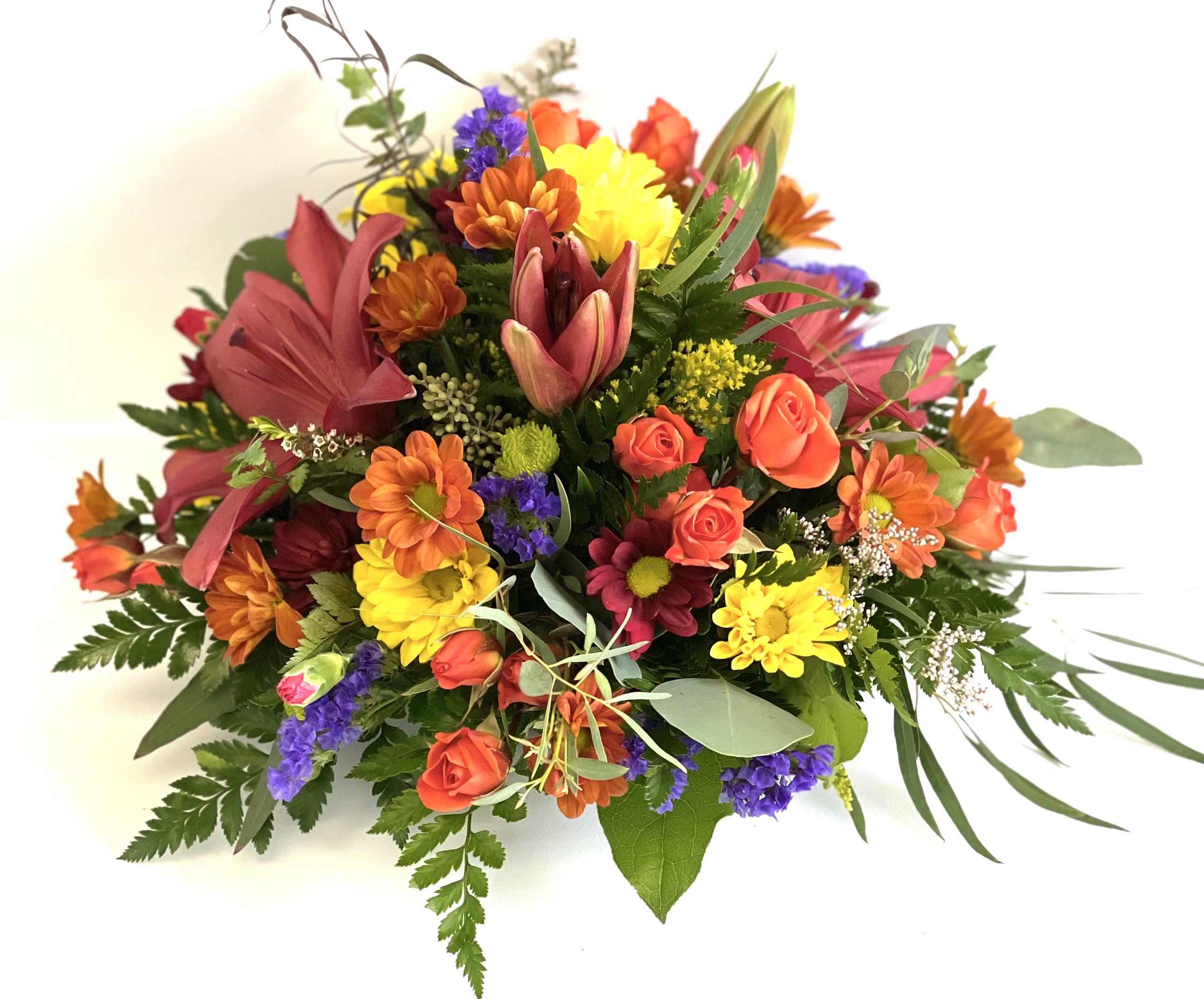 Mixed bouquet of orange, yellow, pink, and purple flowers