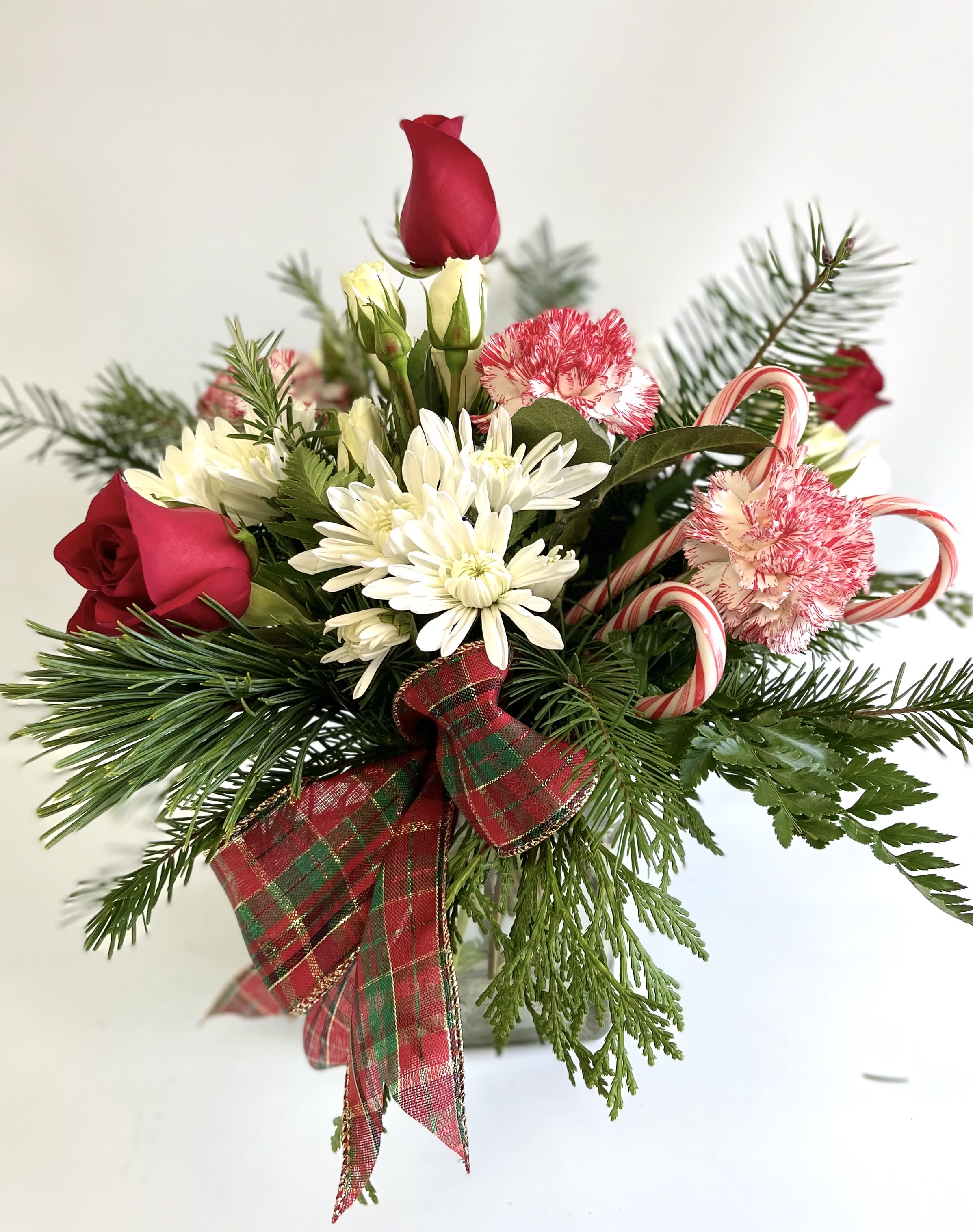 Holiday bouquet with red roses, white daisies, and candy canes