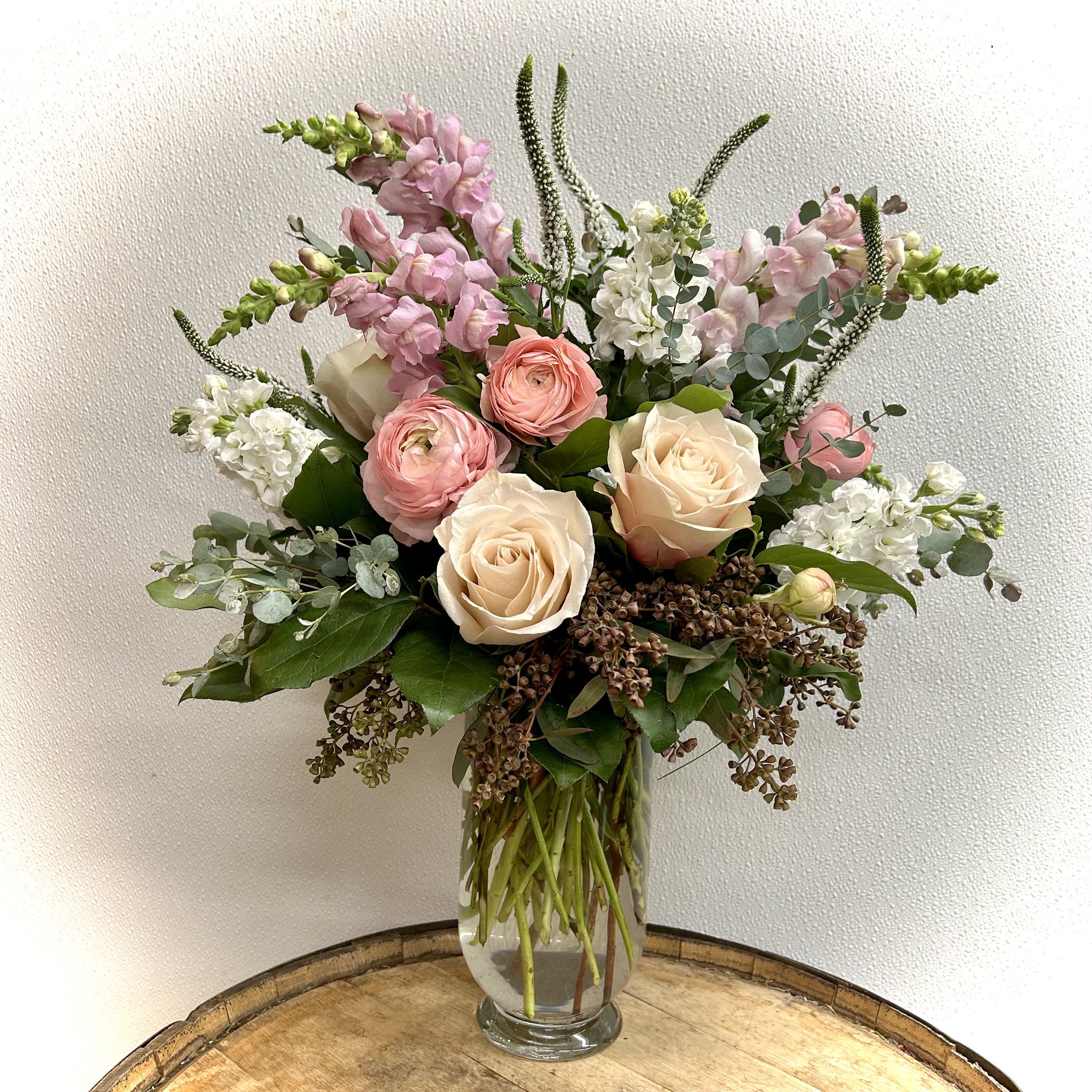 Goldilocks - Beautiful assortment of fresh cut garden flowers and greens in clear glass vase. Not too big...not too small...but JUST RIGHT!
