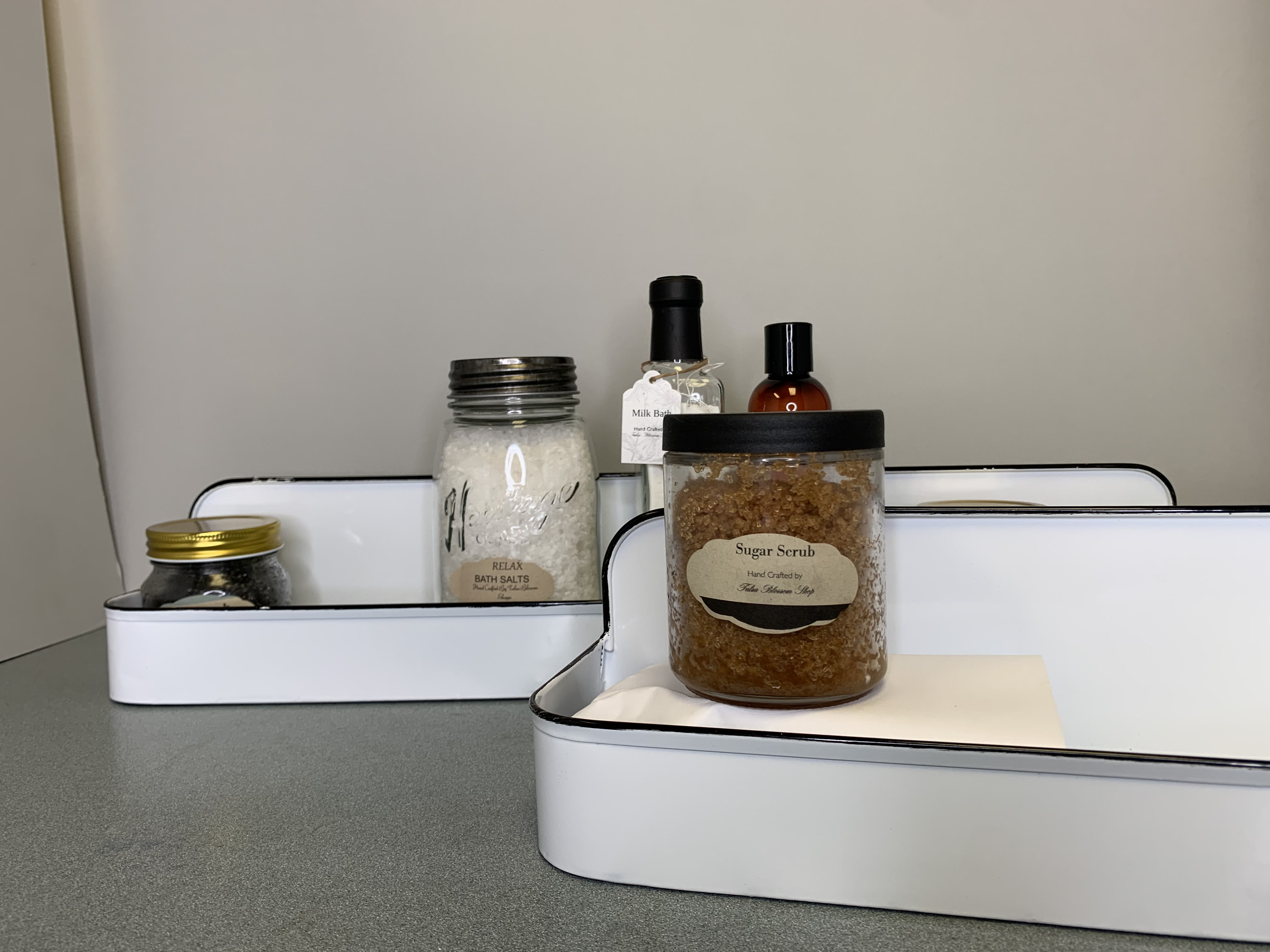Gift trays with bath salts, sugar scrub, and bottles