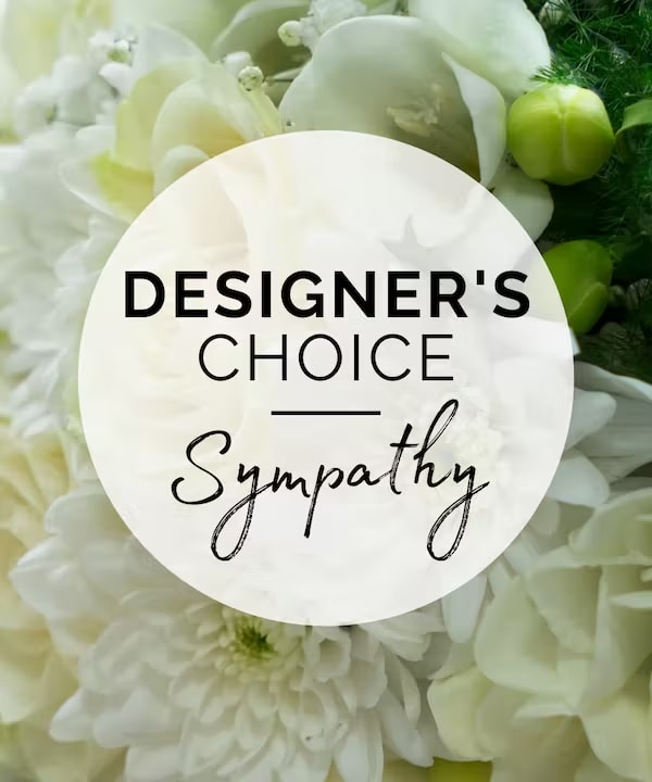White floral arrangement with a sympathy label