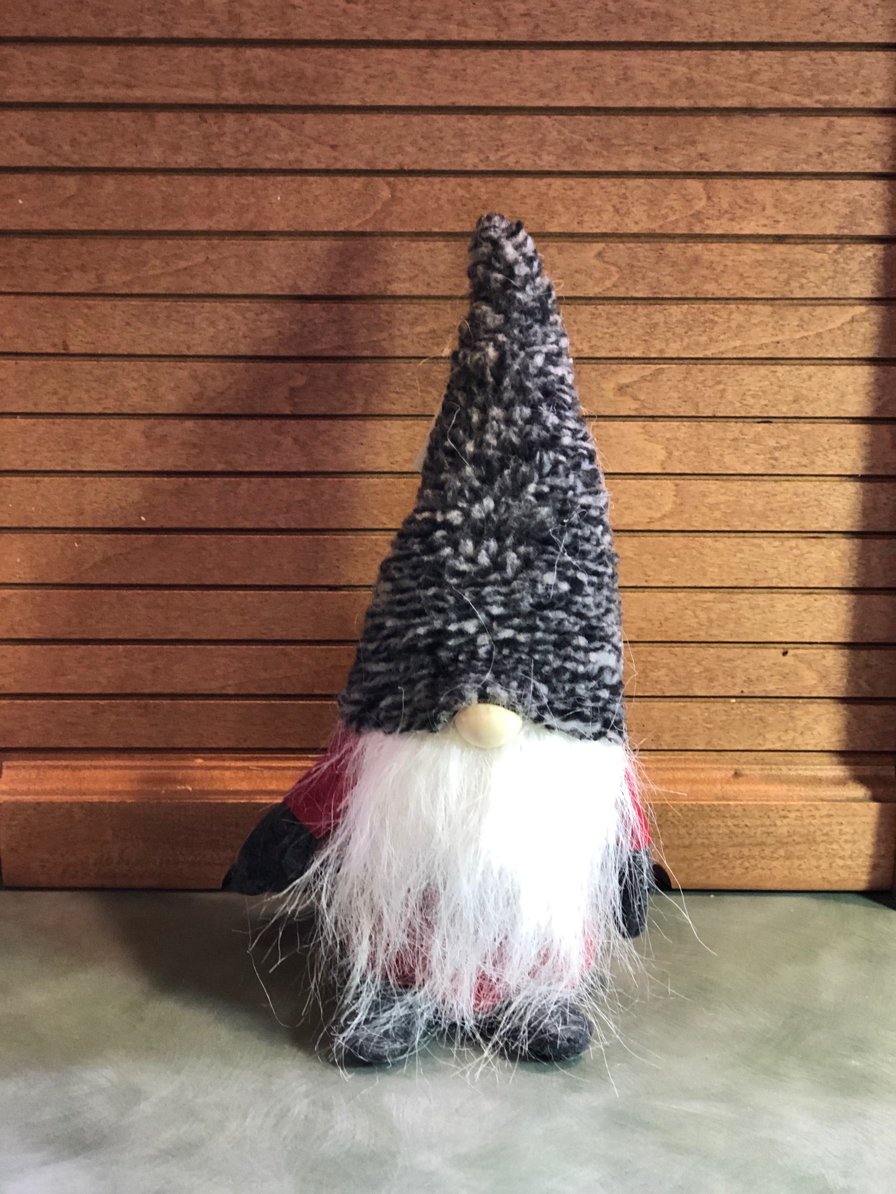 Small gnome figurine with a tall black hat and white beard