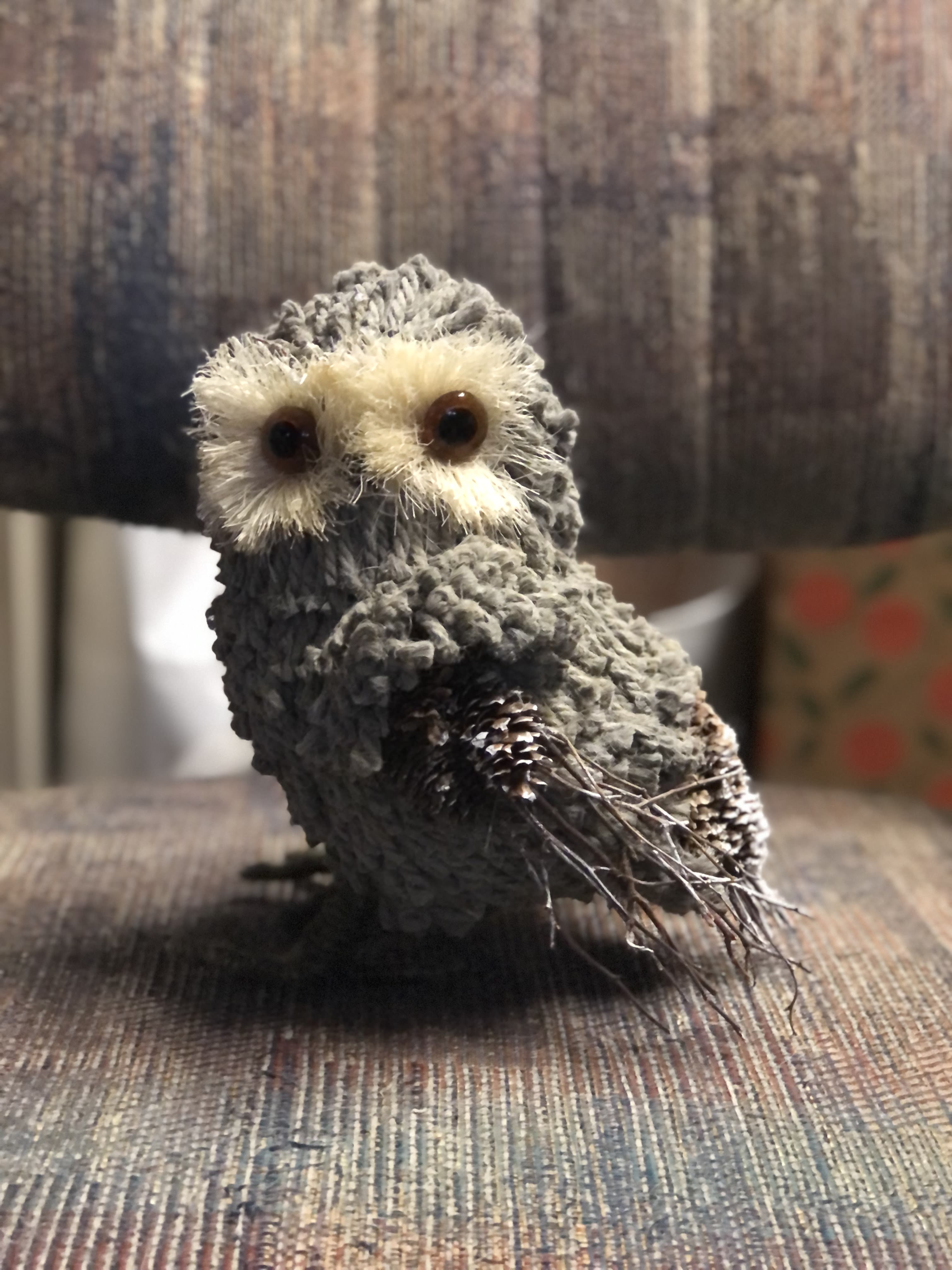 Owl - Our woodland Owl is a great addition to any arrangement. Standing 8" tall and created from wool-like feathers, pinecones and branches.