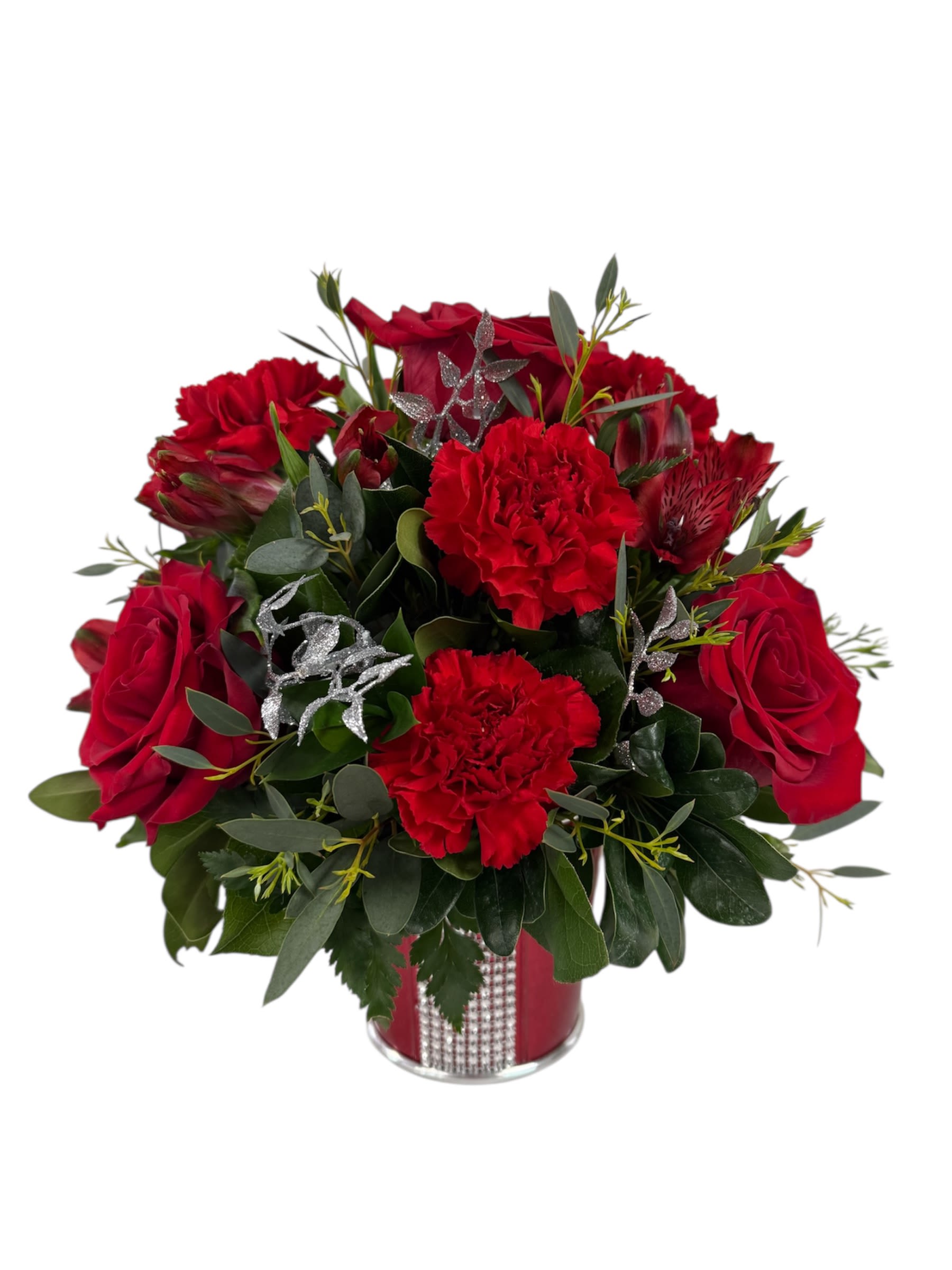 Red roses and carnations arranged in a red vase