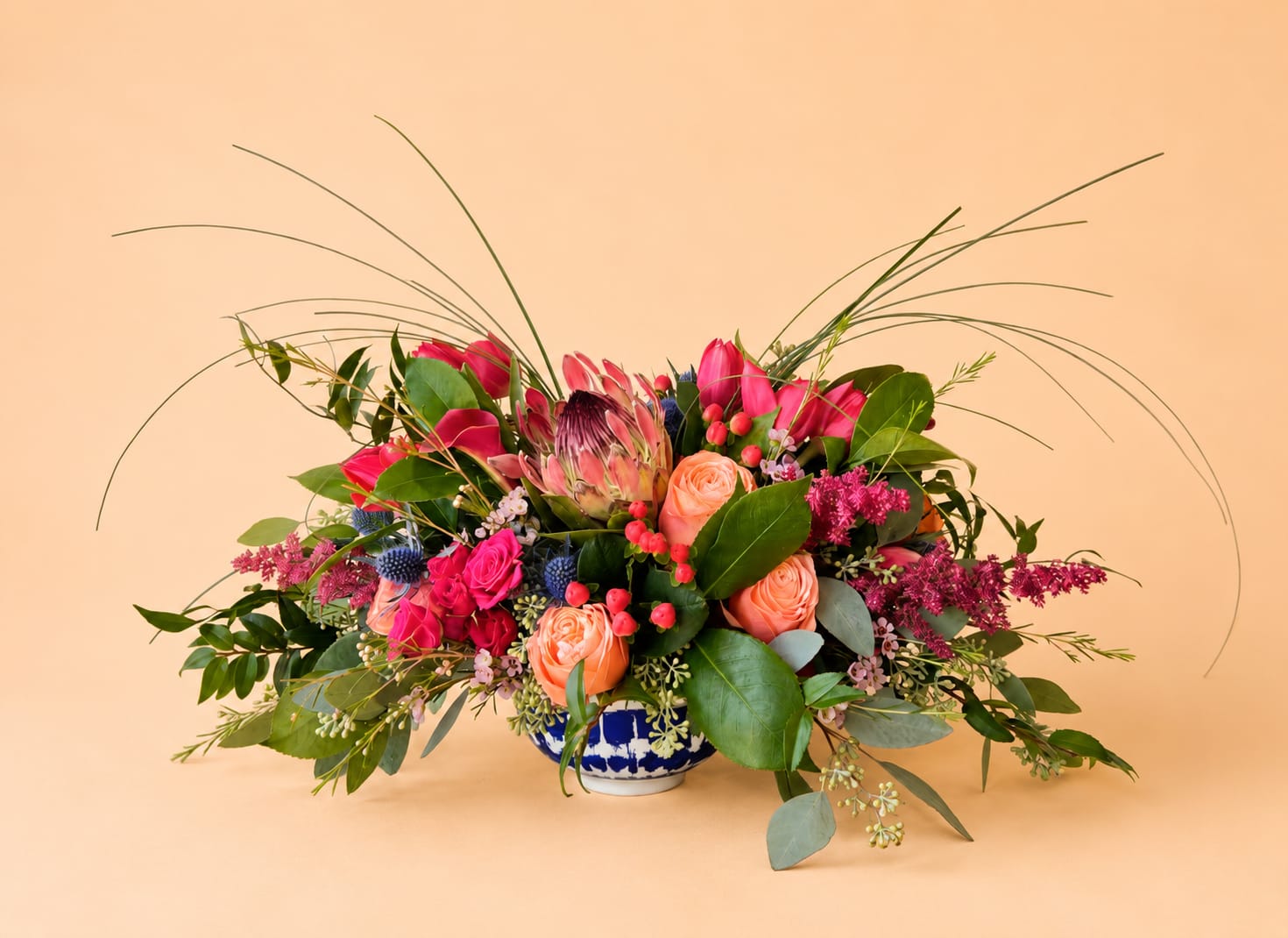 Estate d'Amore - Beautiful one-sided arrangement with a mixture of roses, orchids, hydrangeas, greenery, spray roses, and more.
