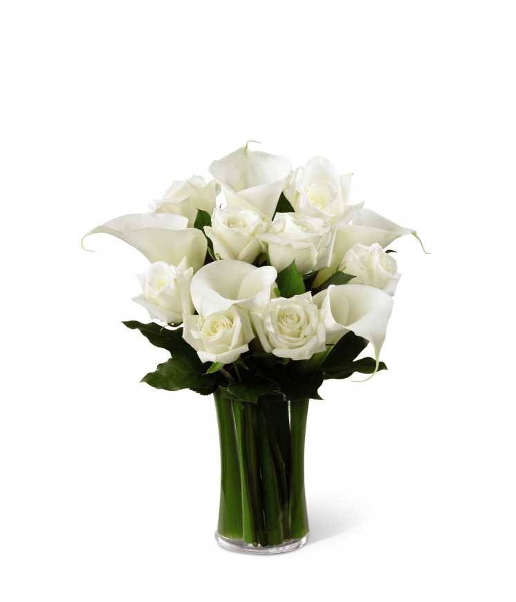 The FTD Sweet Solace Bouquet - The FTD Sweet Solace Bouquet is a divinely elegant arrangement that encourages peace and offers your sympathy. Brilliant white roses and calla lilies are simply set amongst lush greens in a clear glass gathering vase to create a meaningful gift that will help your special recipient through this trying time of grief and loss.