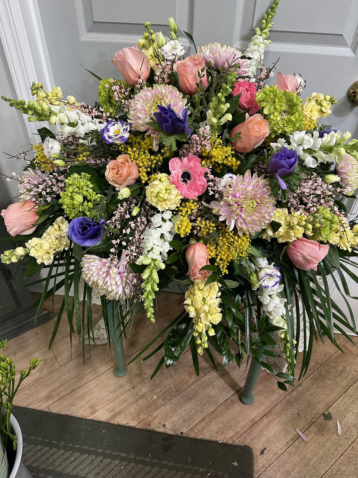 Large mixed floral spray with pink, purple, white, and yellow blooms
