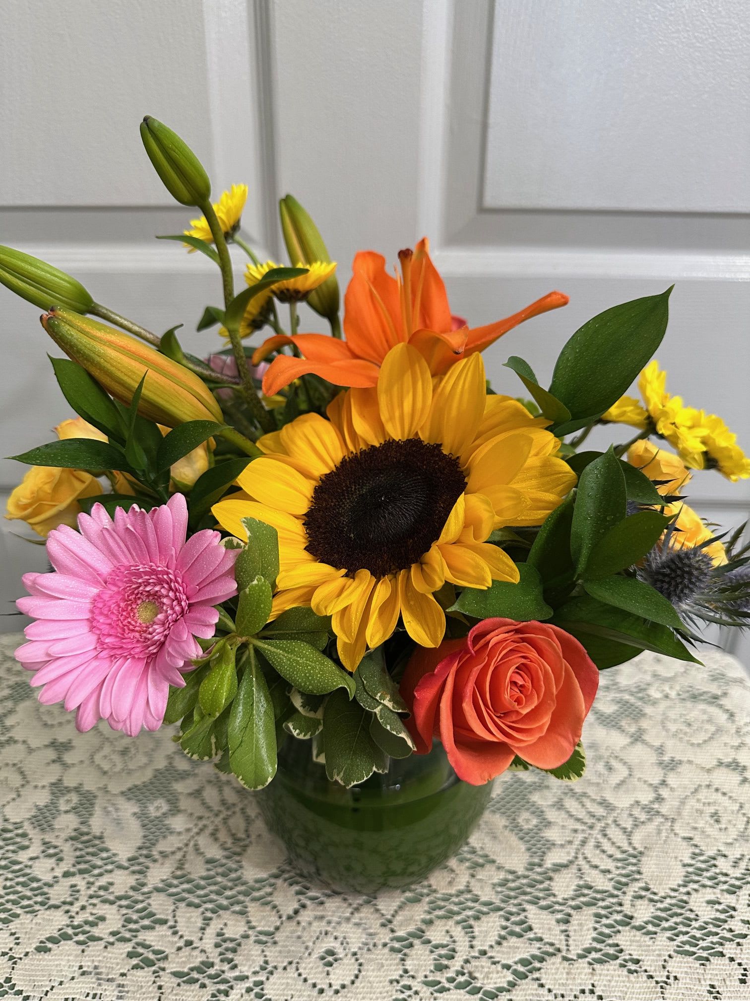 Magnificent Fall Flower Arrangement - Sunflowers(Seasonal) , Calla-Lilies / Dahlia, Gerbera Daisies, Roses,  Wildflowers, Assorted Fancy Greens.  Note:   There are a variety of Sunflowers.  We cannot guarantee  which variety will be available.