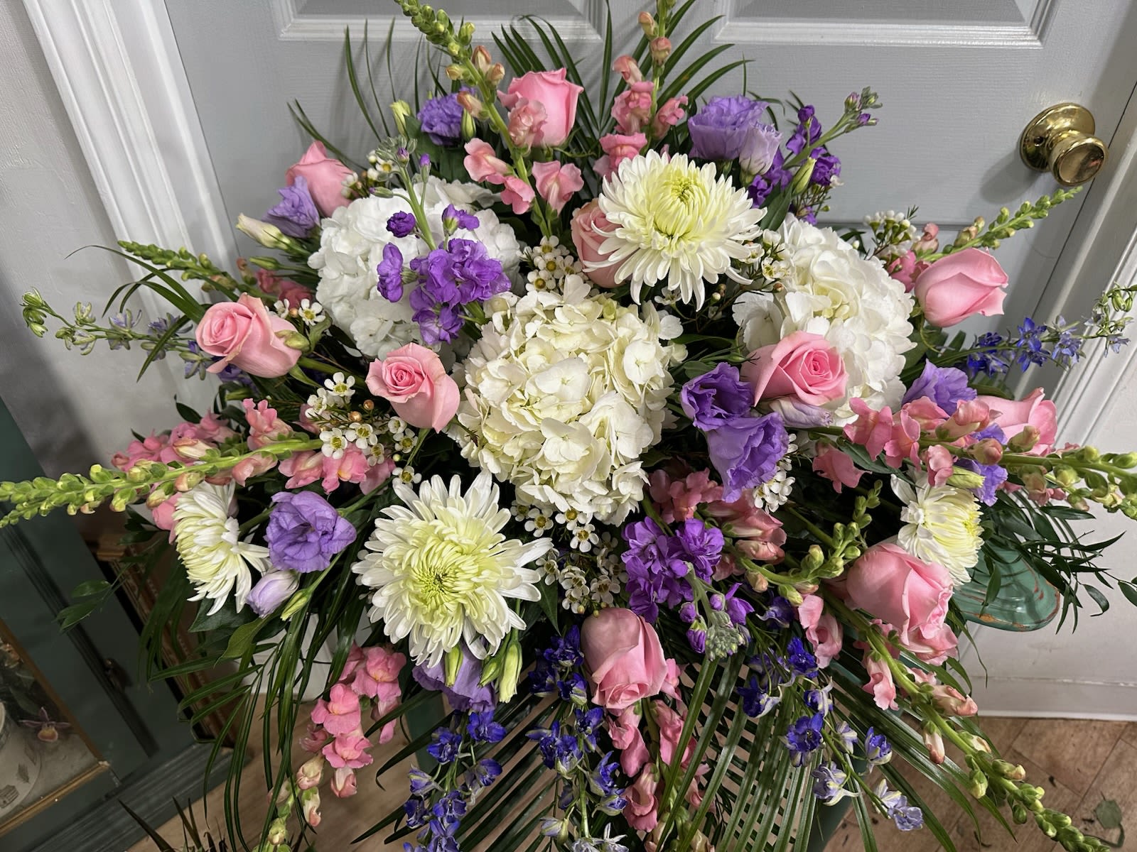 Large bouquet of pink, white, and purple flowers with chrysanthemums and roses