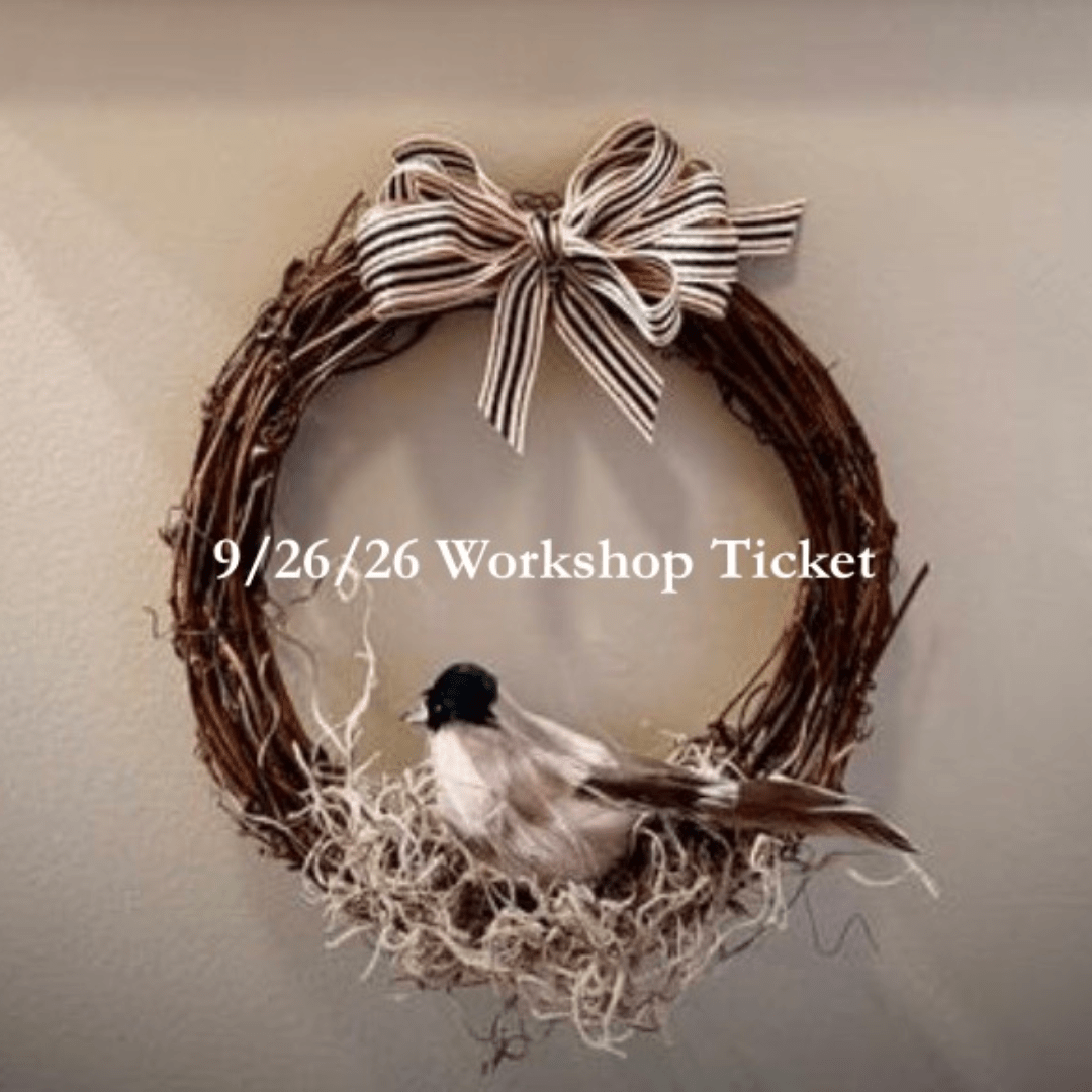 Twig wreath with a striped bow and a small bird decoration