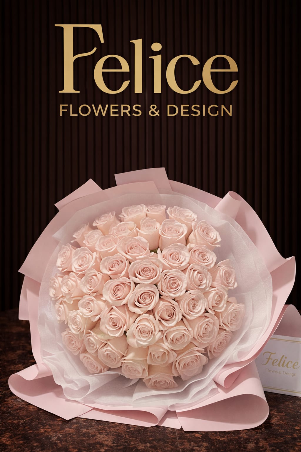 Bouquet of pale pink roses wrapped in pink paper