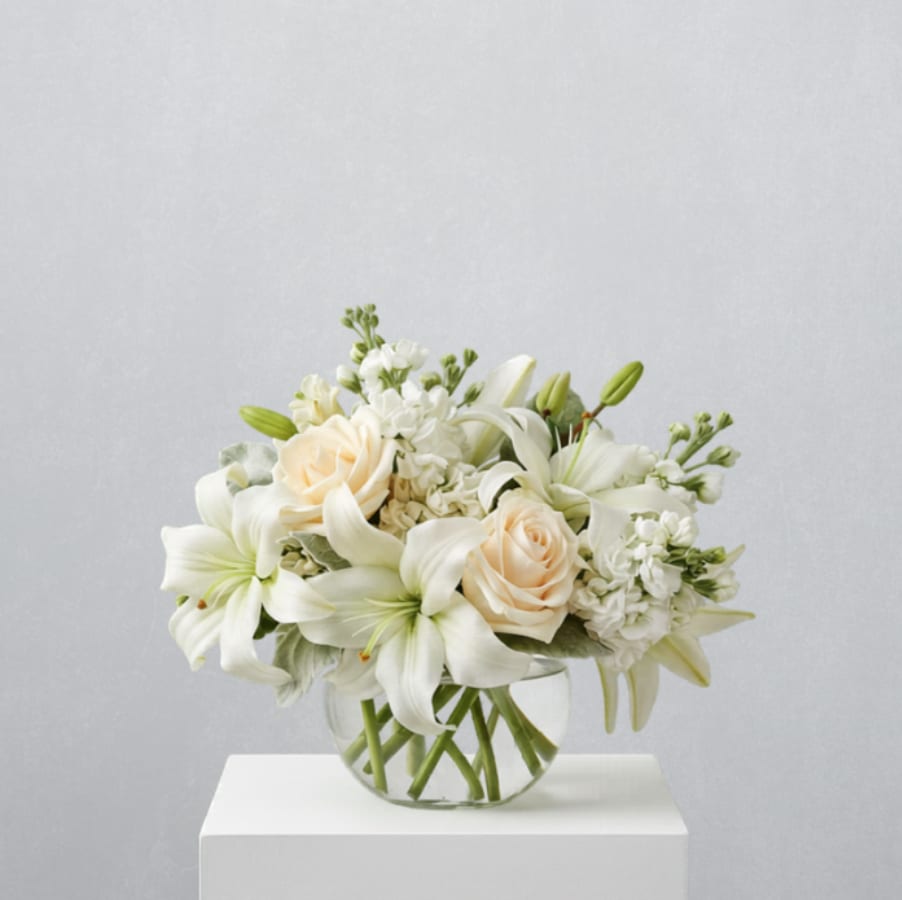 Isle of White by Teleflora - EVERYDAY COLLECTION | LOCAL DELIVERY ONLY  Like a vacation for the senses, this lovely bouquet delivers an oasis of beauty and elegance. Soothing, serene and very special. 
