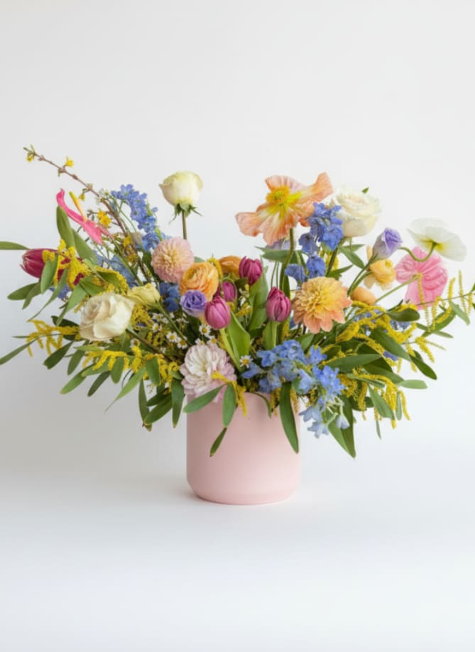 Colorful mixed bouquet in a pink vase