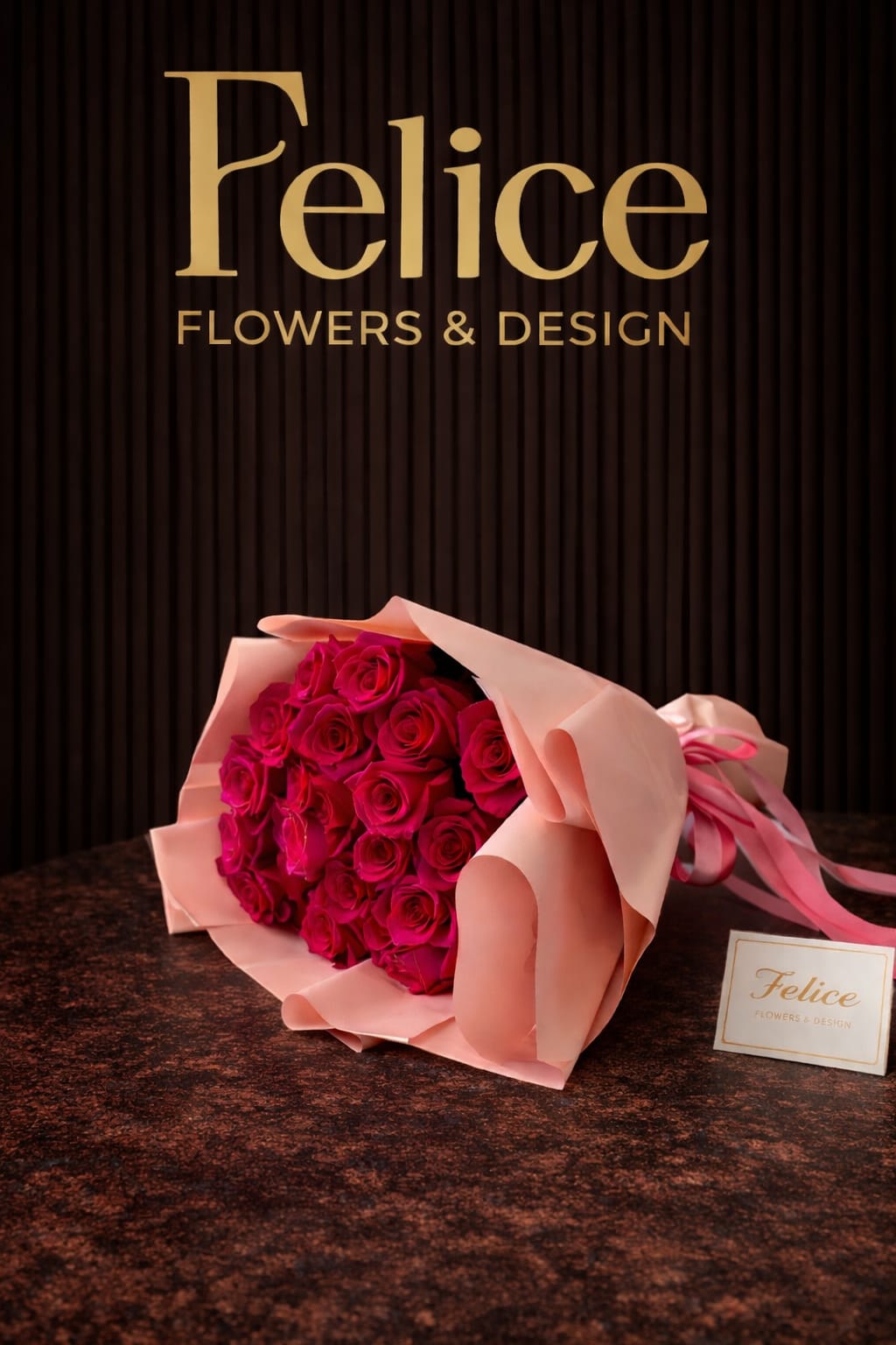 Bouquet of hot pink roses wrapped in pale pink paper
