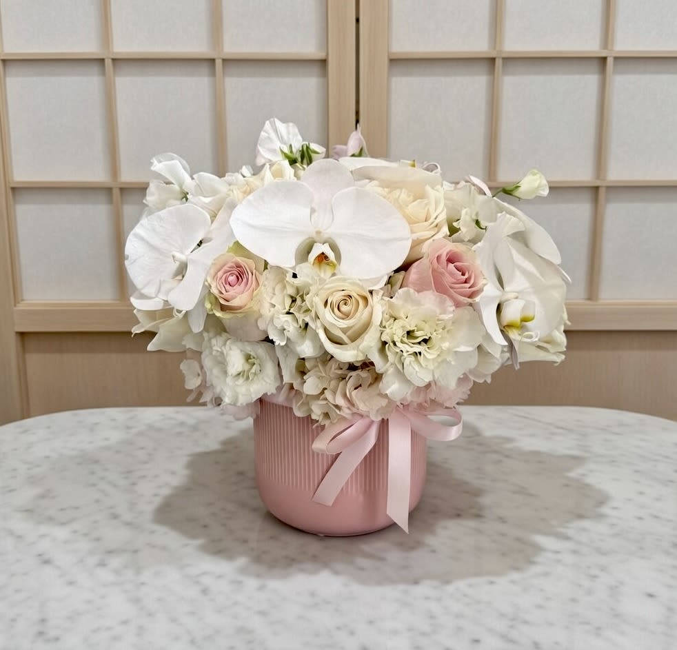 Sakura  - phalaenopses Orchid, premium Roses, Hydrangea, and Lisianthus in Ceramic vase.