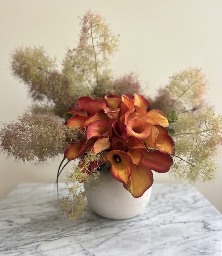 Sherbet Mango - 30 Calla Lillis and Smoke Bush in ceramic vase. 
