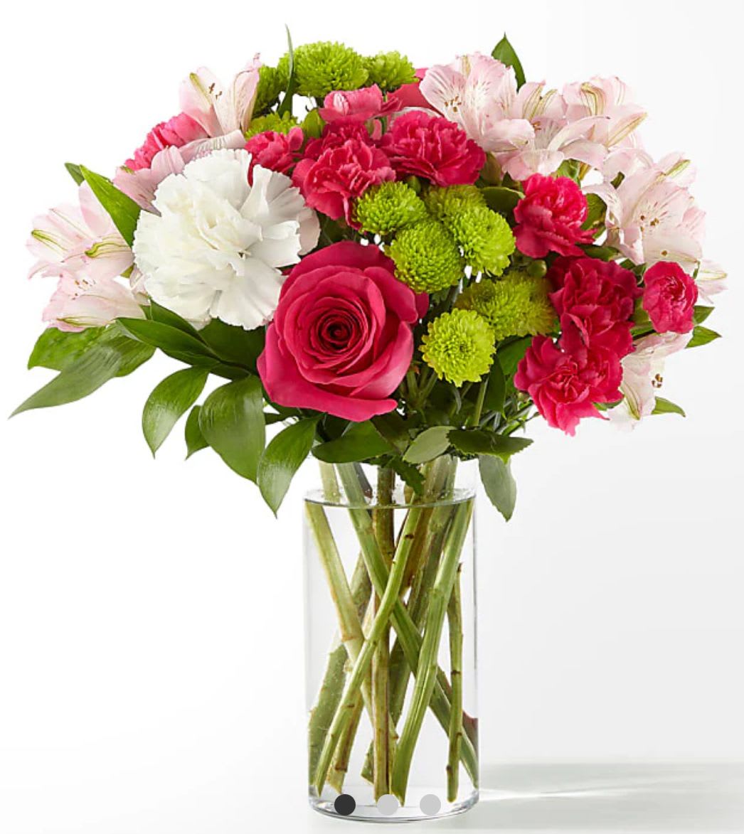 Bouquet of pink and white flowers in a clear glass vase