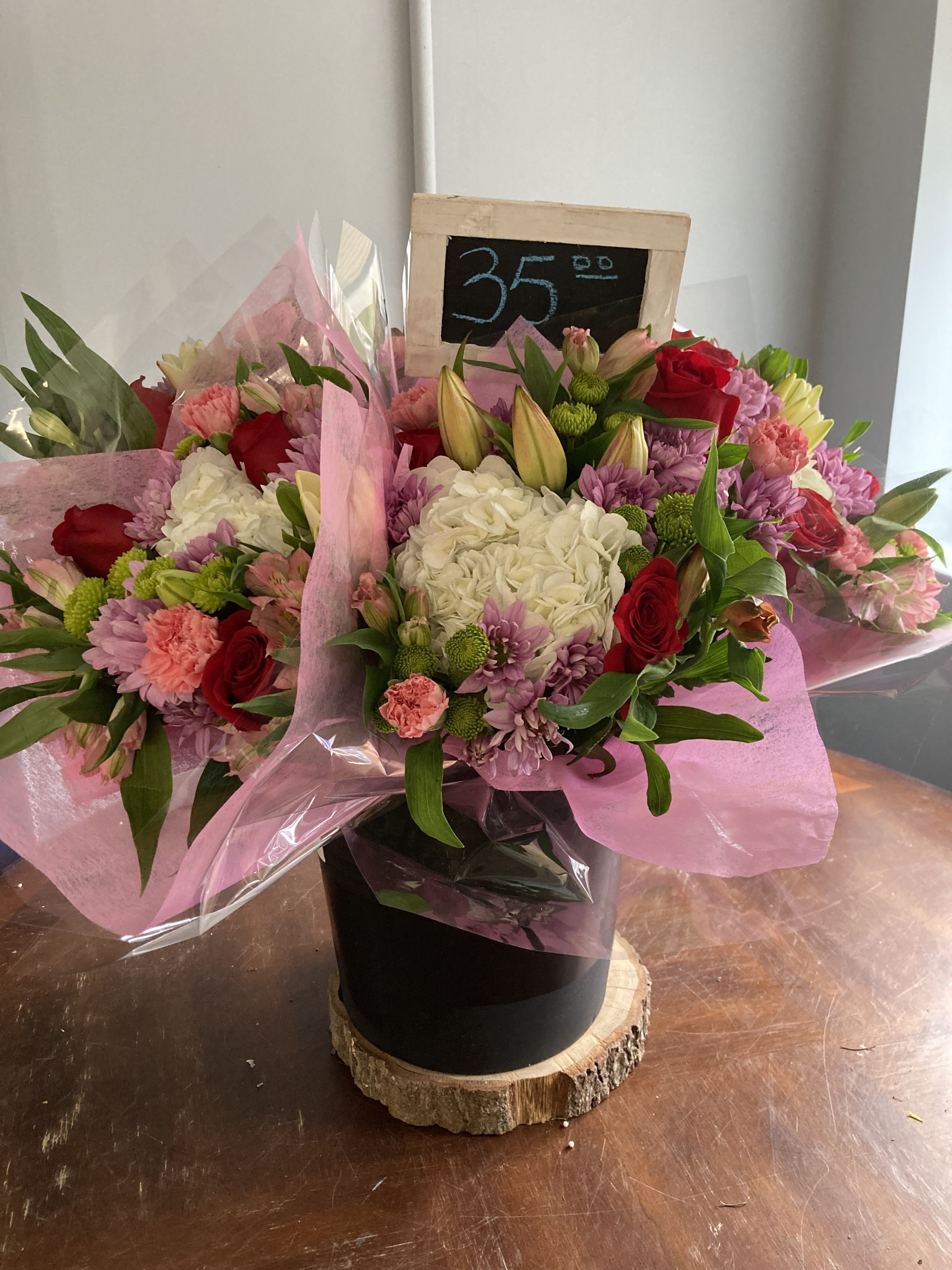 cut bouquet - cut flowers wrapped in paper such as roses, hydrangeas and other fresh flowers