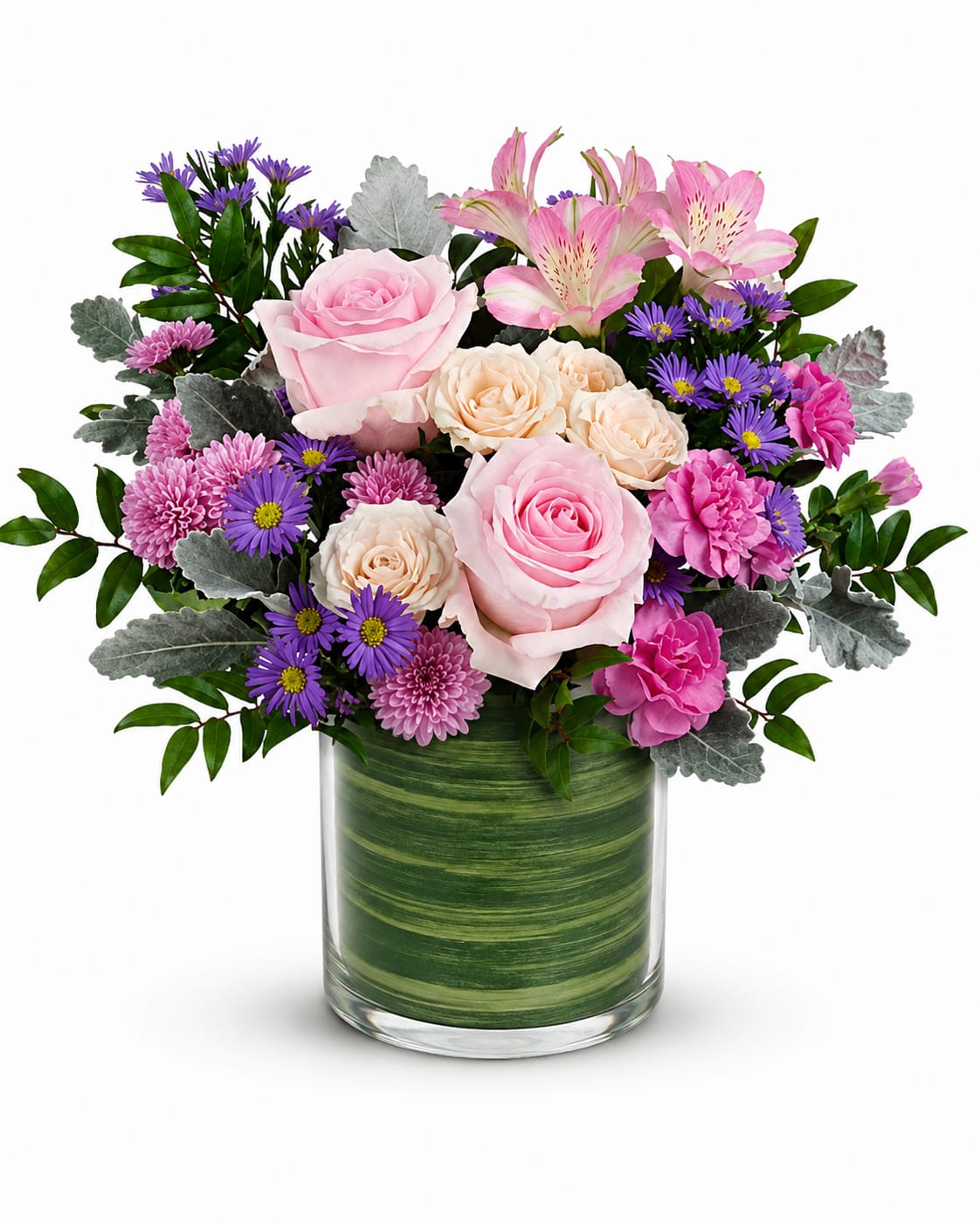Pink and cream roses with purple daisies in a glass vase