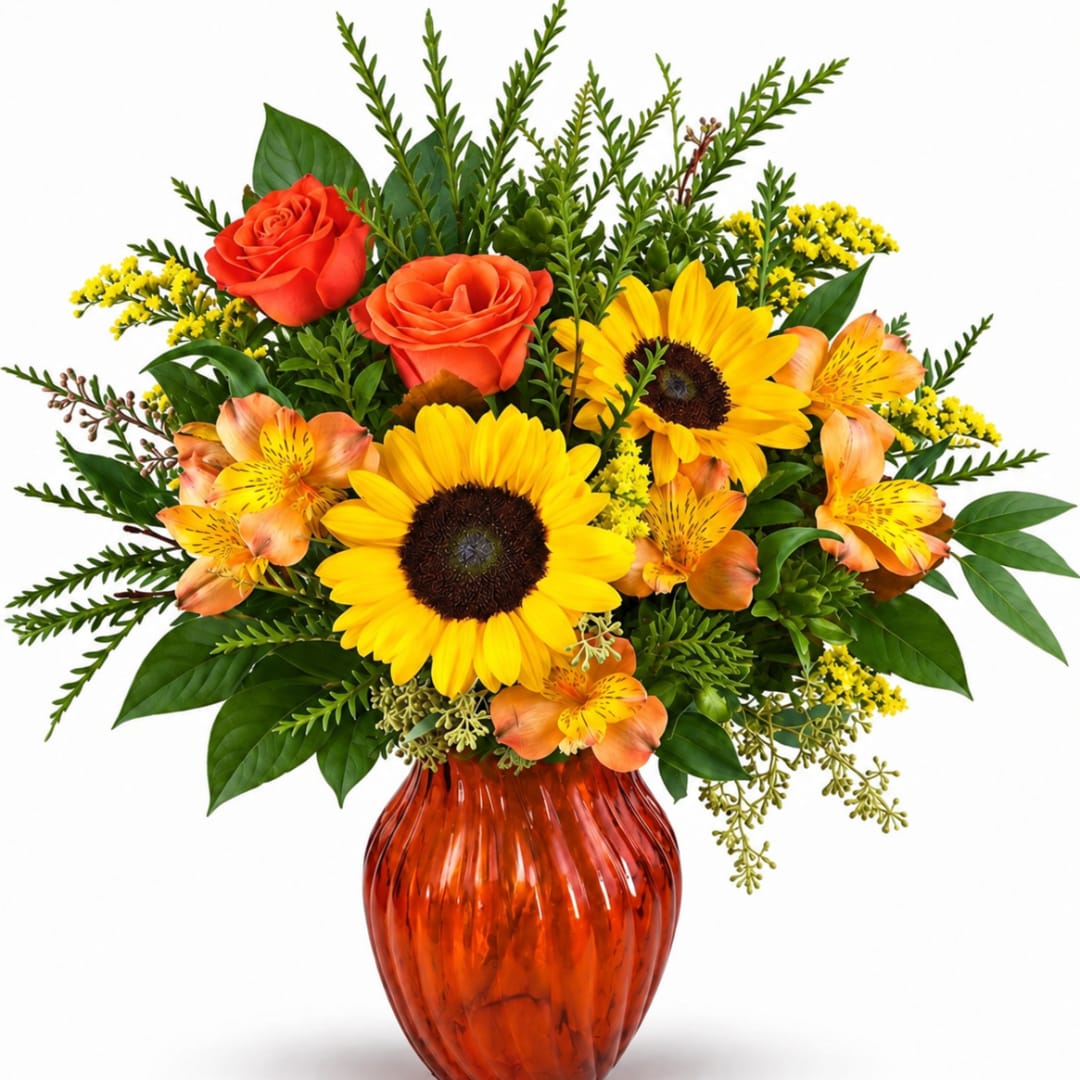 Bouquet of sunflowers, orange roses, and alstroemeria in an amber vase