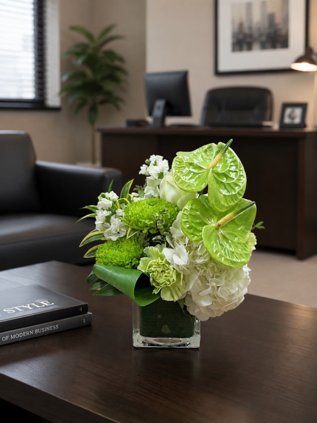 New!  Pure and Simple  - A serene green and white bouquet that reads calm and refined - Pure and Simple is a flower arrangement perfect for a "just because" thought, sympathy gesture, or an understated wedding accent. The close grouping of anthuriums, hydrangea, carnations, roses, stock, and cremon mums creates a soft impact that will make the person you're thinking of feel seen and comforted without fuss.  Ideal for sending to someone who appreciates quiet elegance, Pure and Simple fits thoughtful everyday gifting, weddings, anniversaries, or sympathy. See the Care and handling QR code included with your delivery for watering and upkeep so the arrangement stays fresh as long as possible.