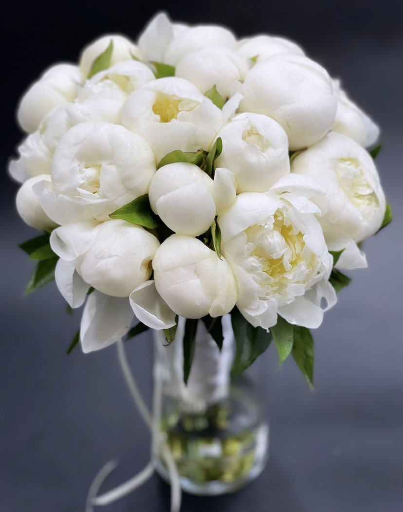 White peony bouquet in a clear glass vase