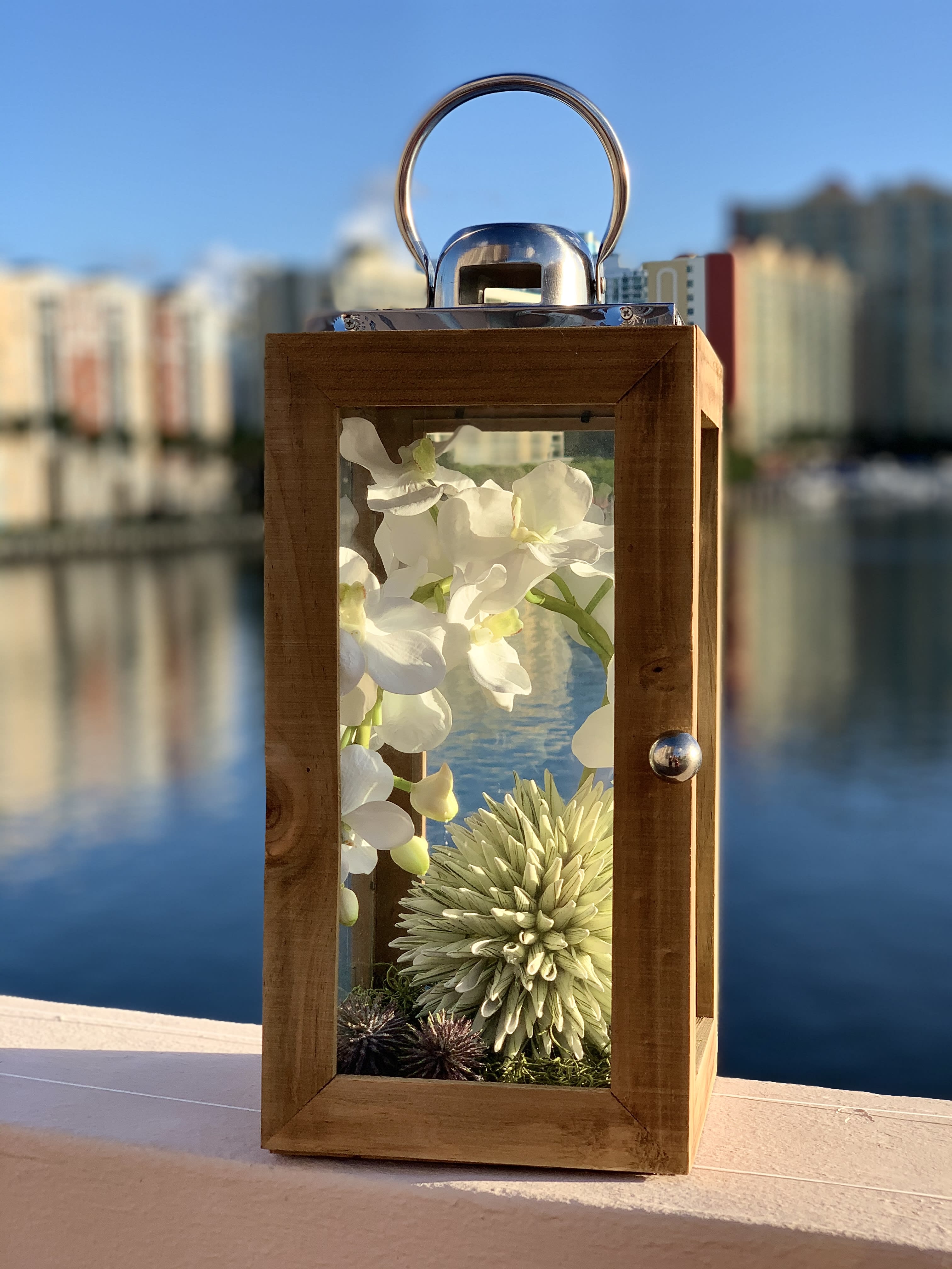 Meadow - Silk orchids with flowers in a wooden box. Custom made. Beautiful decor for your home.   Silk flowers are crafted from a protein fibre spun by the silk worm, producing lifelike flowers. Flowers described as being made of silk with a "real touch technique" are not made of silk, but rather are made of polyester, polymers and plastics.  Pre order 2 days.  ▪️ Delivery to their door Each bouquet is unique and is prepared by an expert florist and our customer service team is at your service to ensure the best experience possible.  ▪️Bouquets you can enjoy for longer Some flowers arrive a little closed to ensure extra freshness and protection during shipping. Enjoy the magic of seeing them fully bloom. 